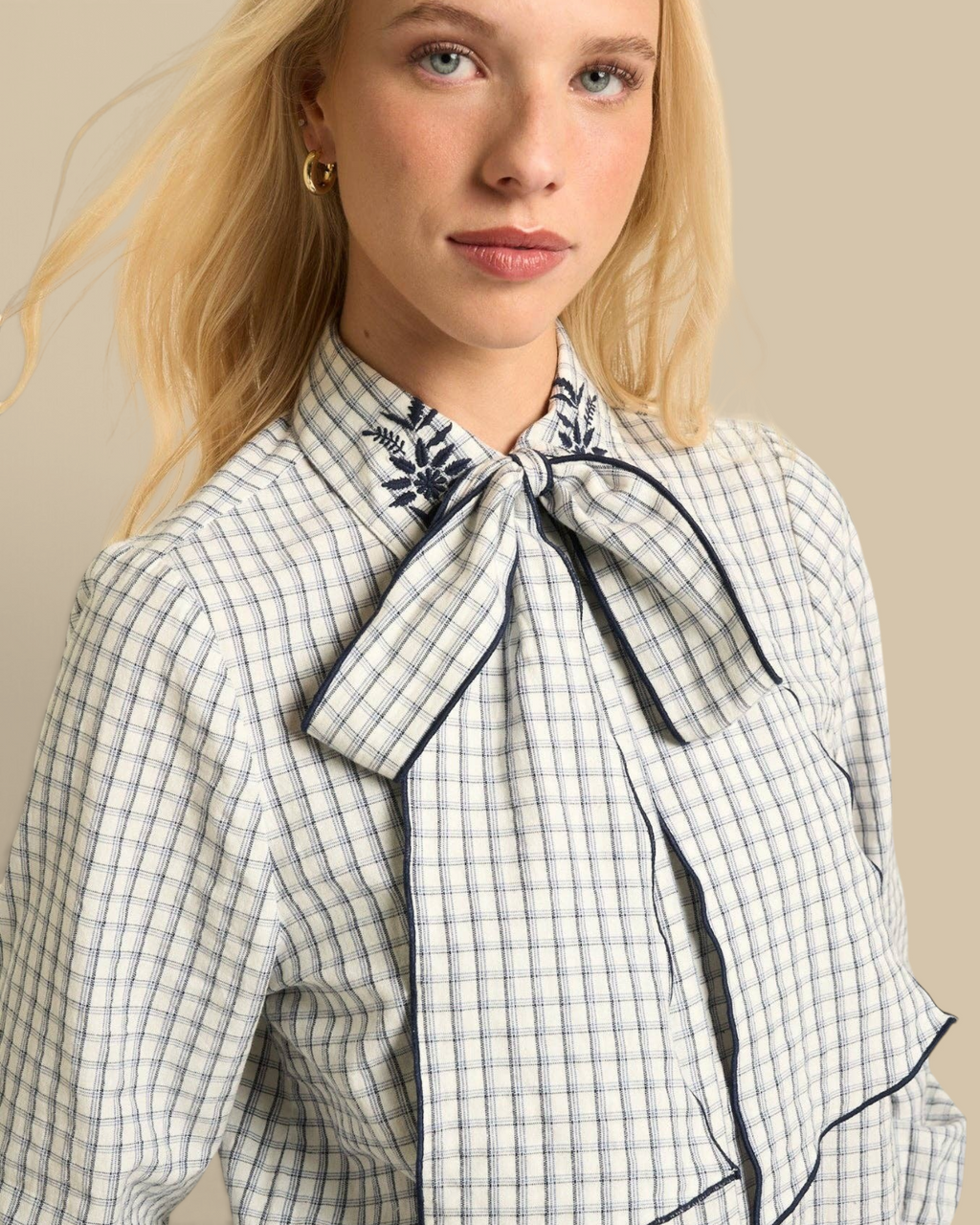 Homestyle Collective Lily Blouse in navy gingham cotton with embroidered collar and elegant tie-neck detail.
