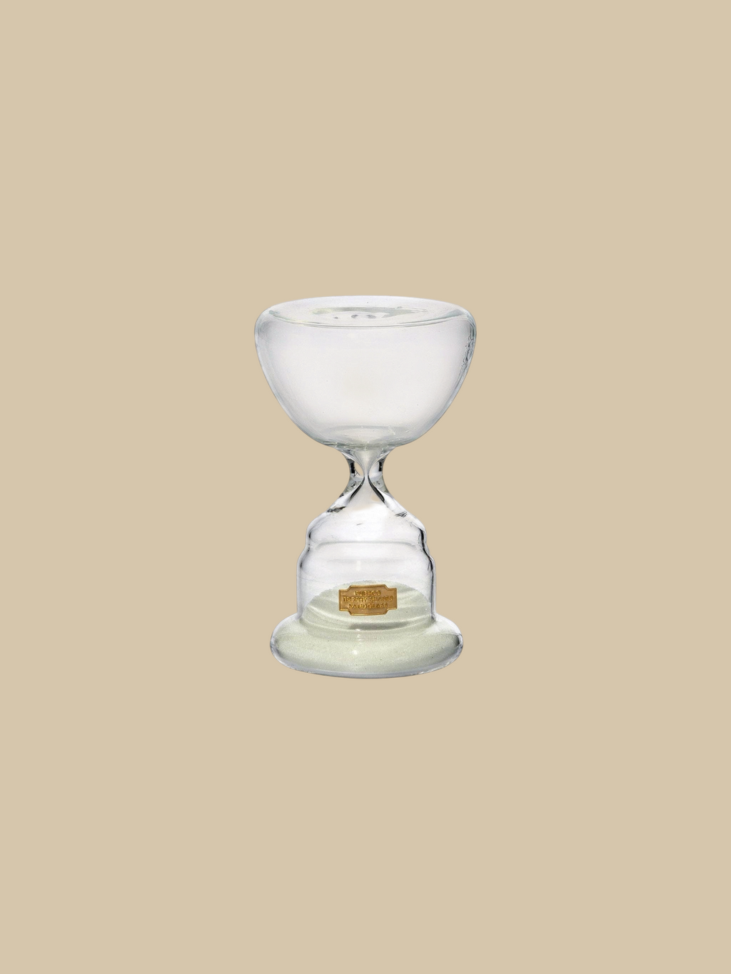 Homestyle Collective trophy shaped glass hourglass with white sand, 10-minute timer for elegant home decor.