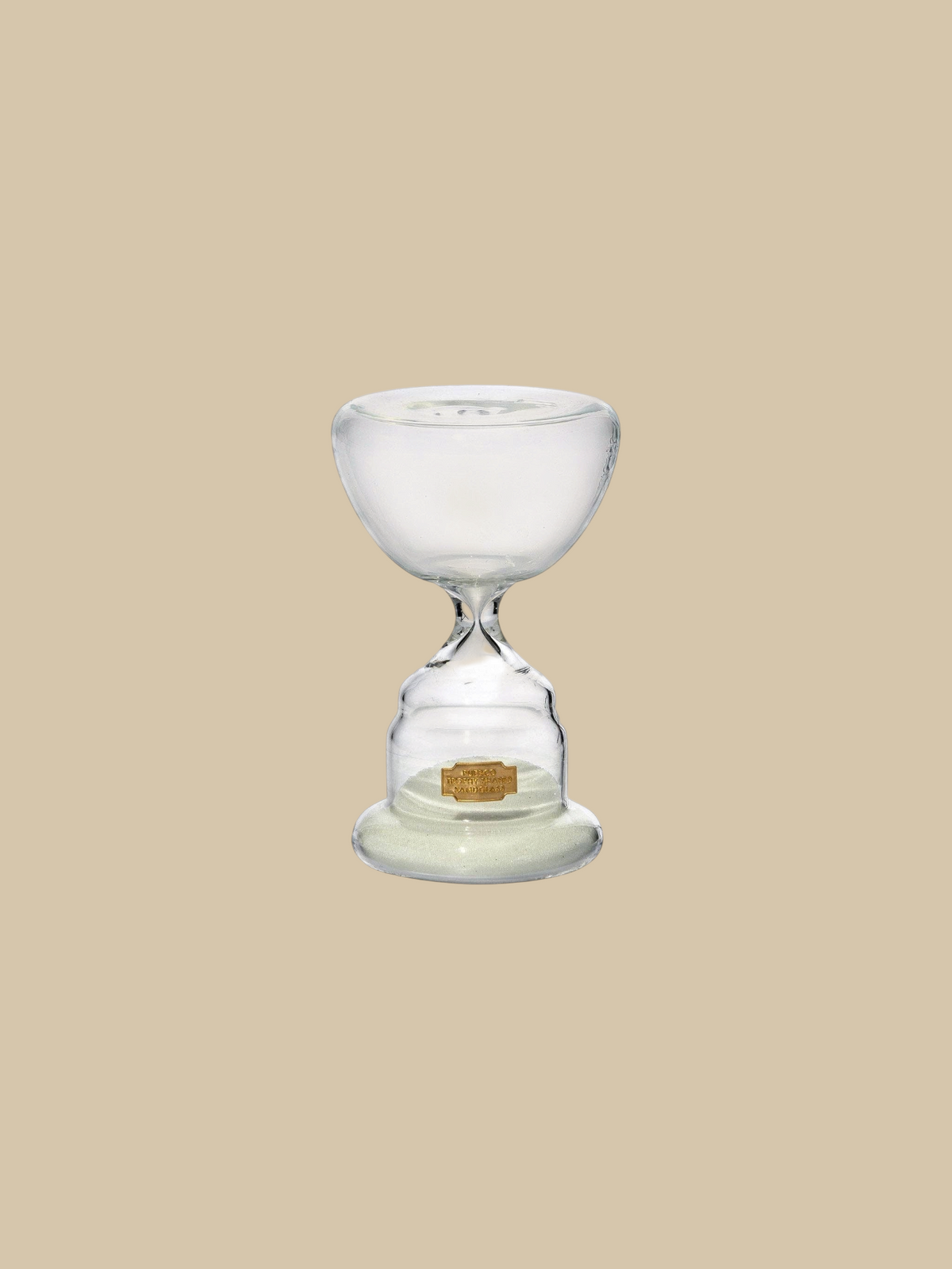 Homestyle Collective trophy shaped glass hourglass with white sand, 10-minute timer for elegant home decor.