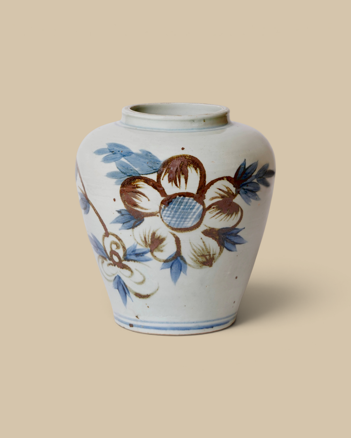 Homestyle Collective hand-painted porcelain vase featuring brown and blue sunflower motifs on a white background.