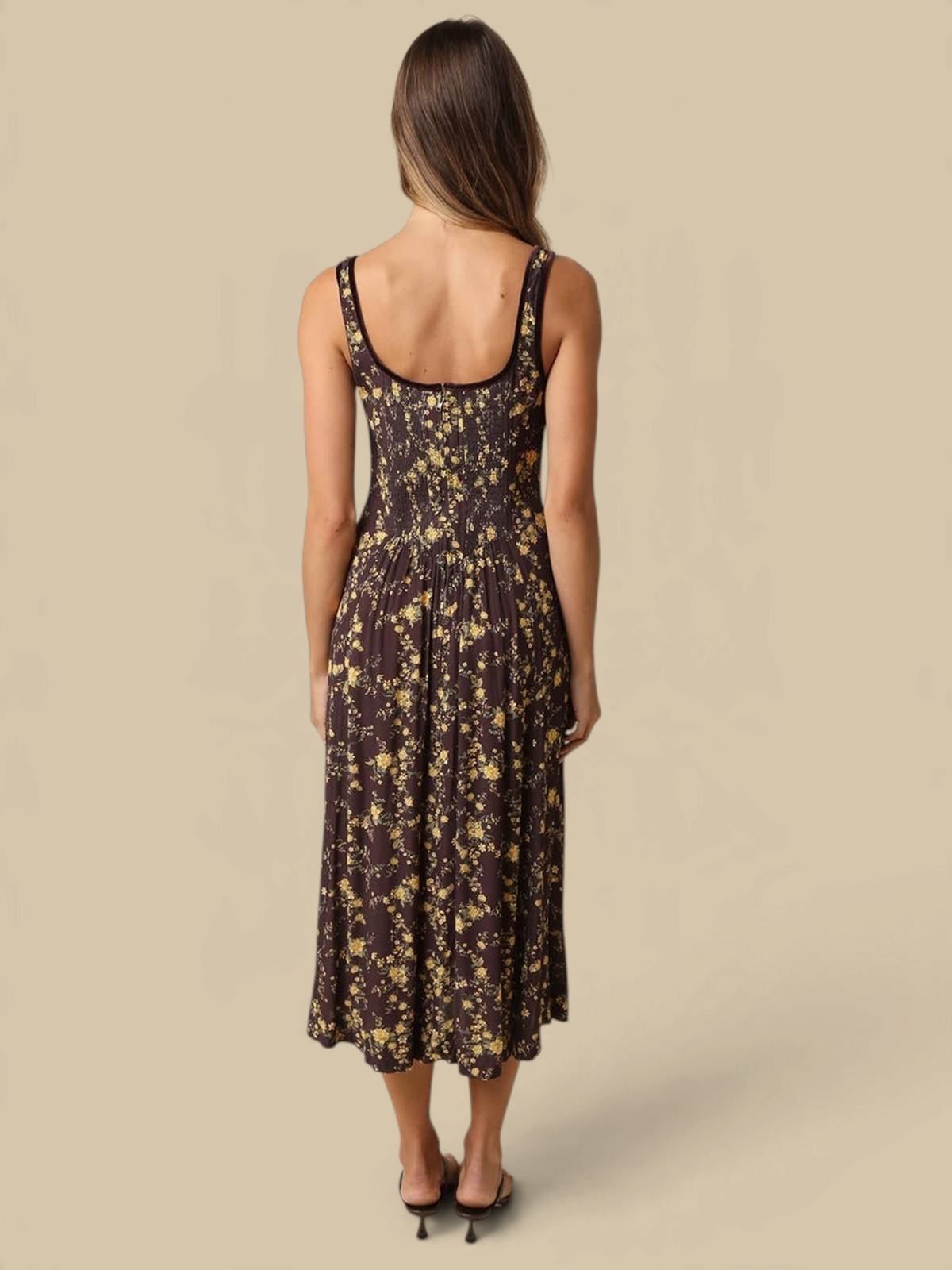 Back view of Homestyle Collective Sofia floral midi dress with square neckline and flowing skirt on a model