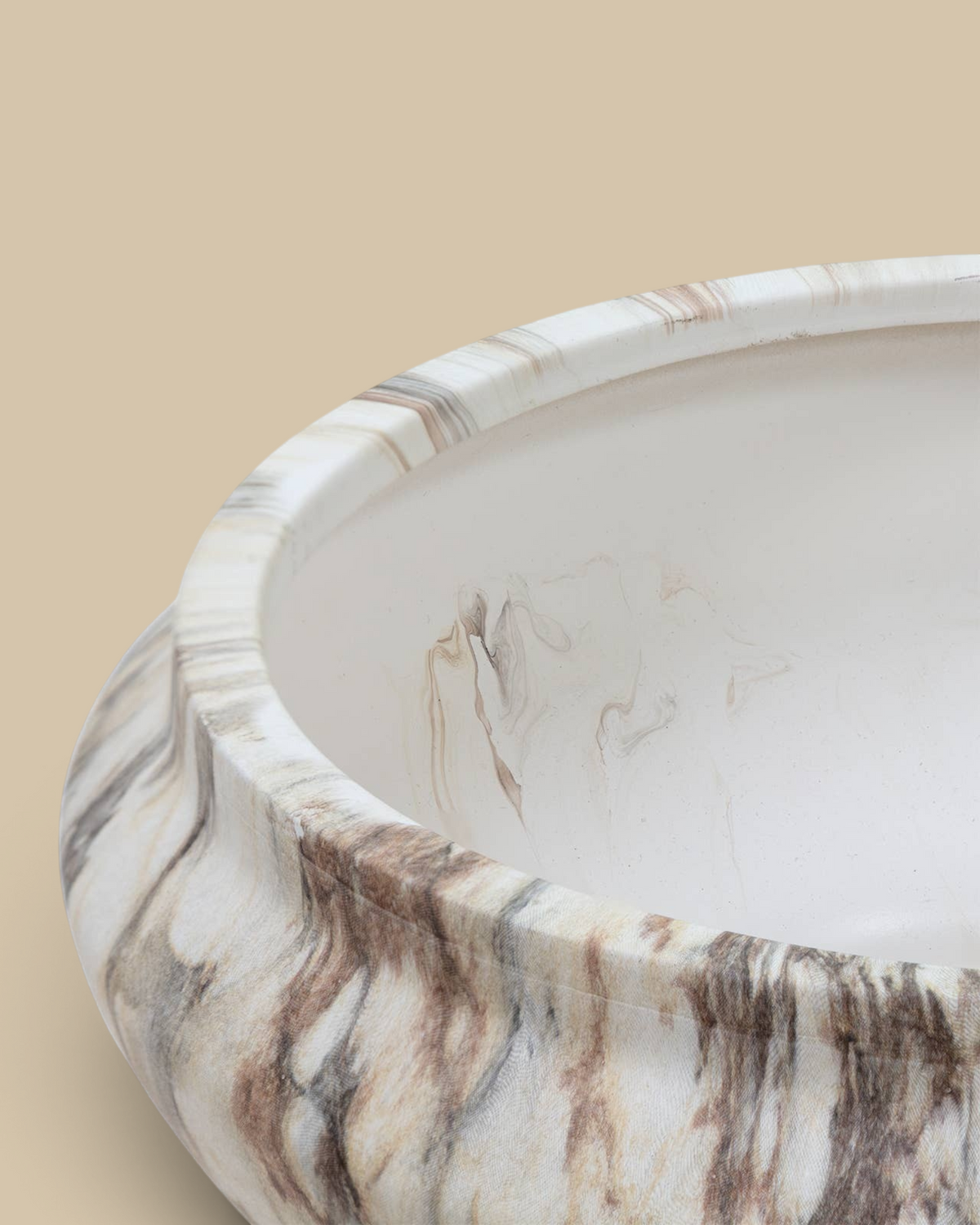 Homestyle Collective Fenmir round ceramic bowl with a brown and beige marble finish for elegant tabletop decor.