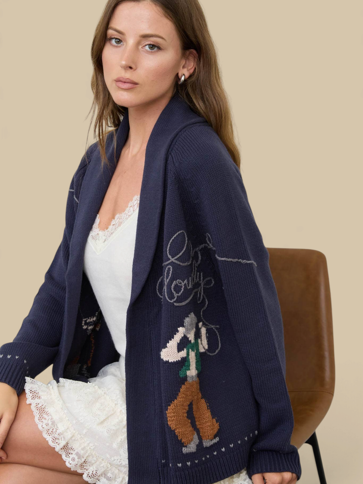 Homestyle Collective navy knit cardigan with Howdy Cowboy jacquard pattern, shawl collar, and relaxed open-front fit.