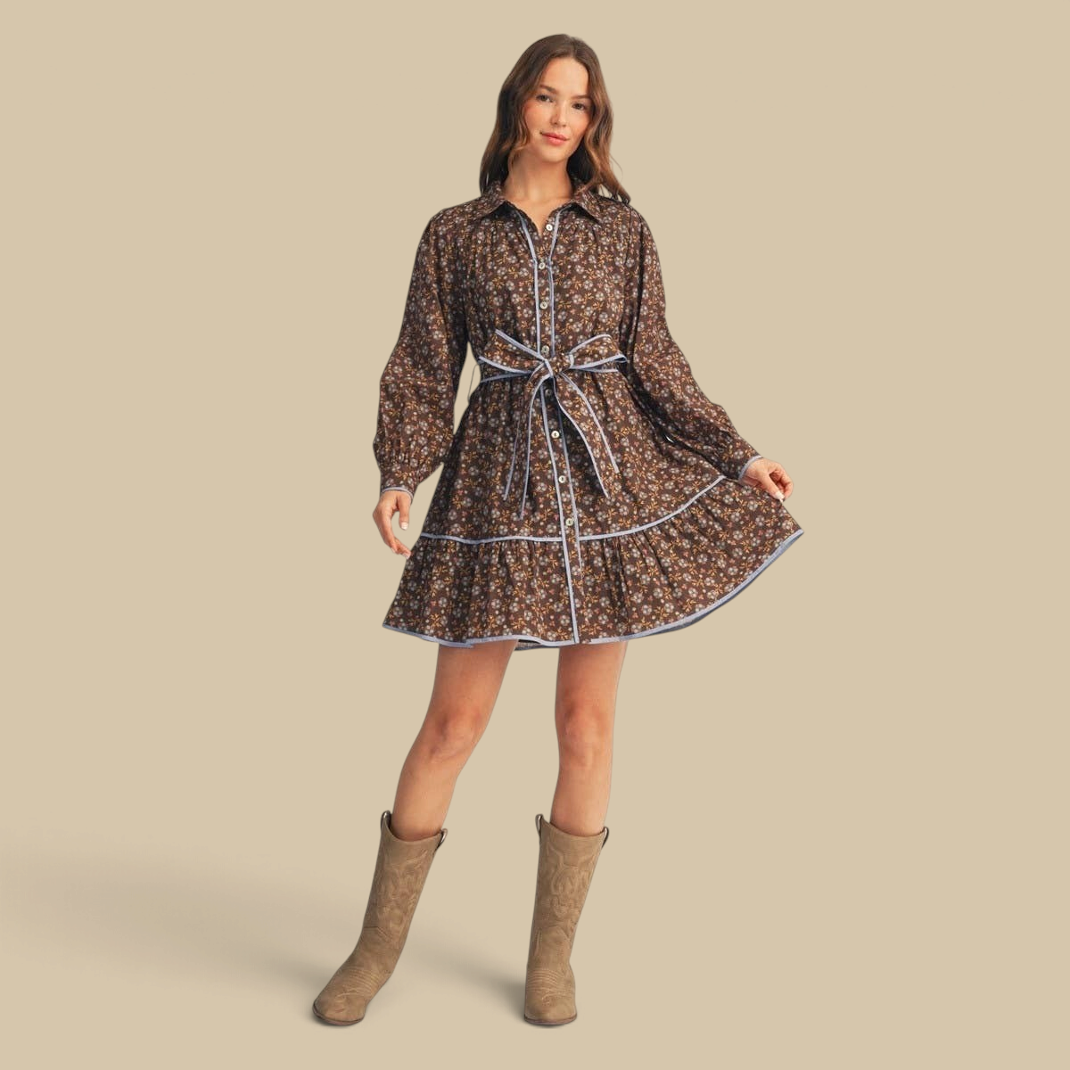 Homestyle Collective brown floral cotton dress with waist tie, button front, long sleeves, and blue contrast piping.