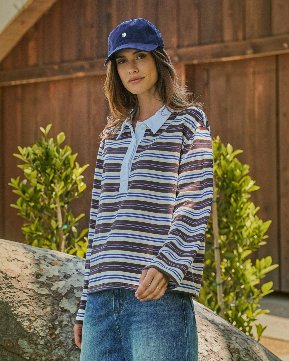 Homestyle Collective striped rugby polo with brown, blue, and cream horizontal stripes and a pale blue collar.