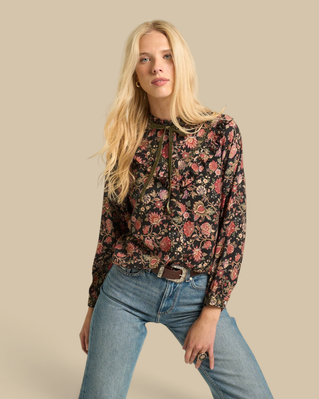 Homestyle Collective Hazel blouse in black floral viscose with ruffle detail and olive velvet neck tie on a model