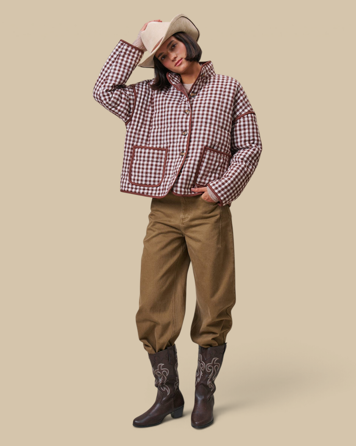 Homestyle Collective tan cotton barrel leg pants with a high-rise fit, styled with a gingham jacket and cowboy boots.