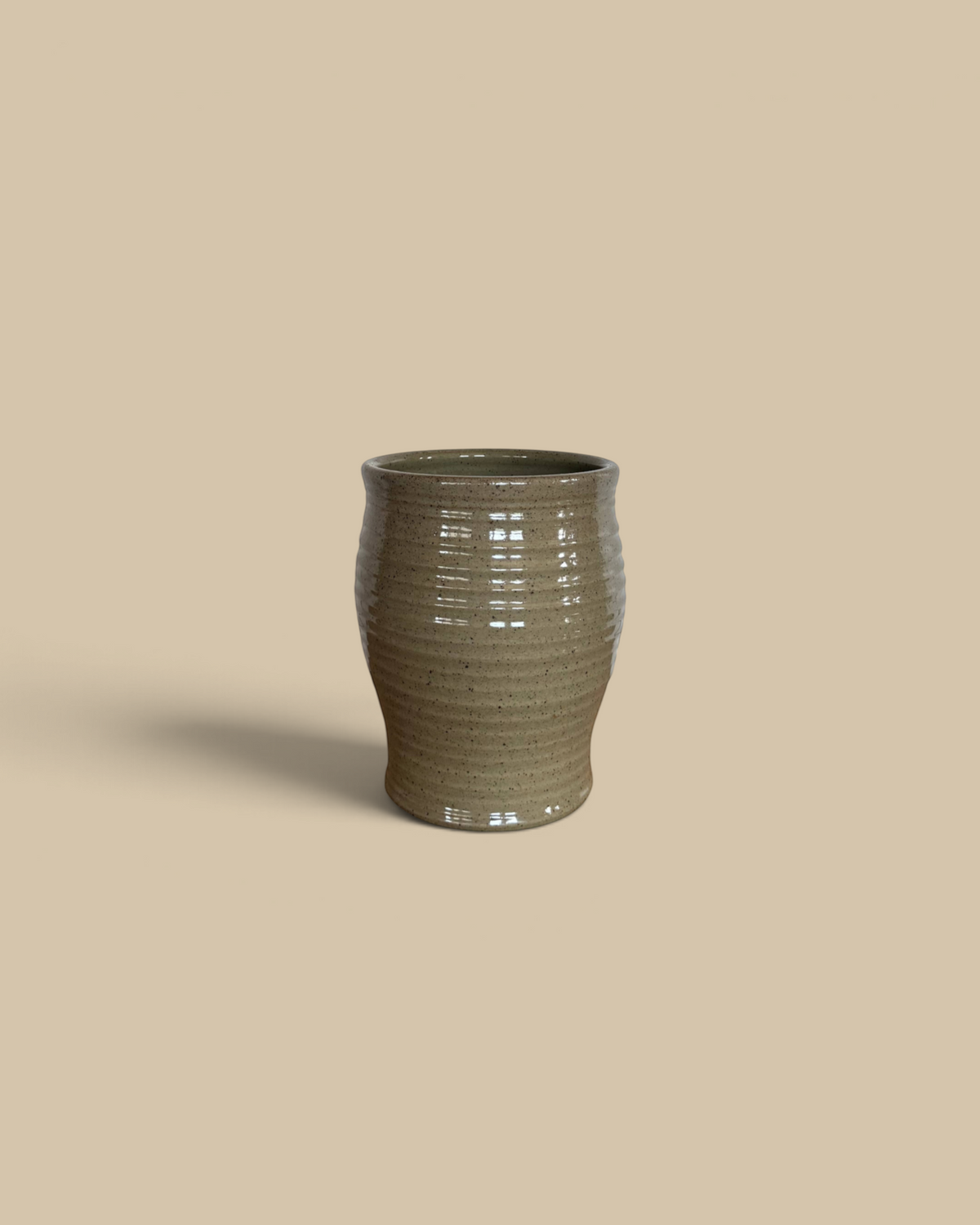 Homestyle Collective Ridges Utensil Jar in mocha glaze, a handcrafted ceramic kitchen tool holder with ribbed texture.