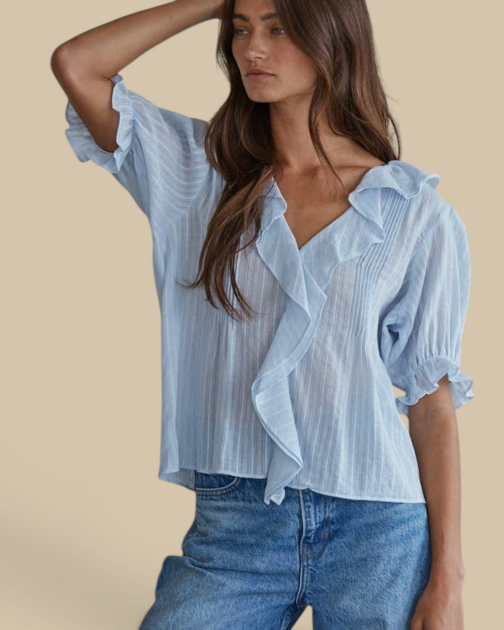 Homestyle Collective powder blue cotton blouse with ruffle trim, pintuck details, and V-neck worn by a model.