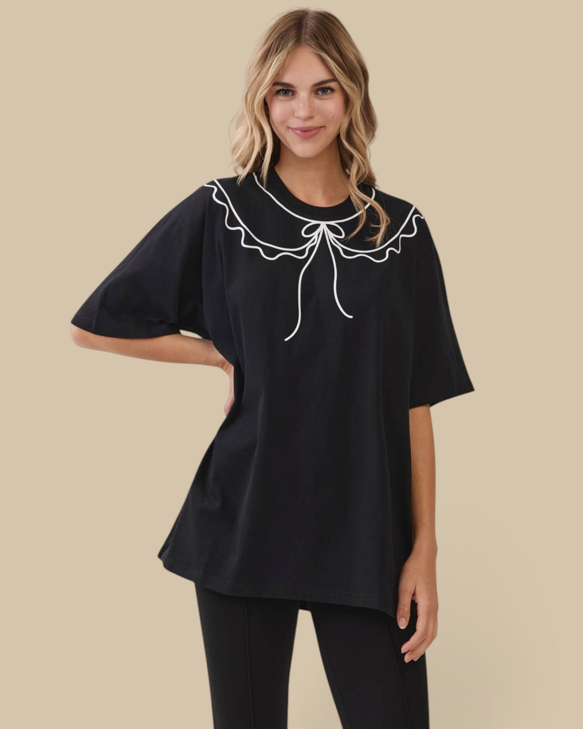 Homestyle Collective black oversized cotton tunic tee featuring a white scalloped collar with a bow detail