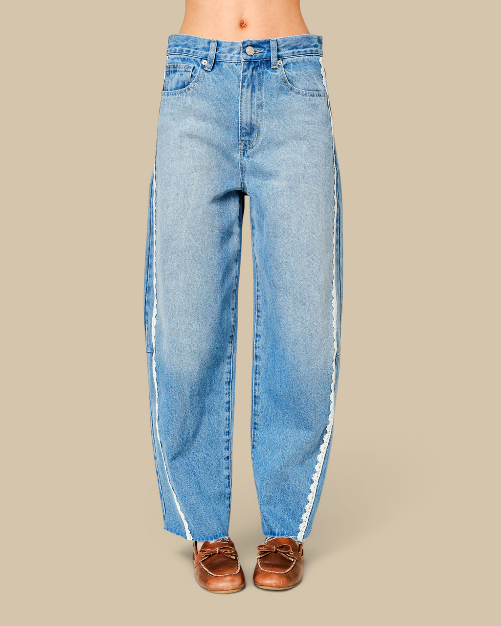 Homestyle Collective mid-rise light wash denim barrel jeans featuring delicate white lace trim along the side seams.