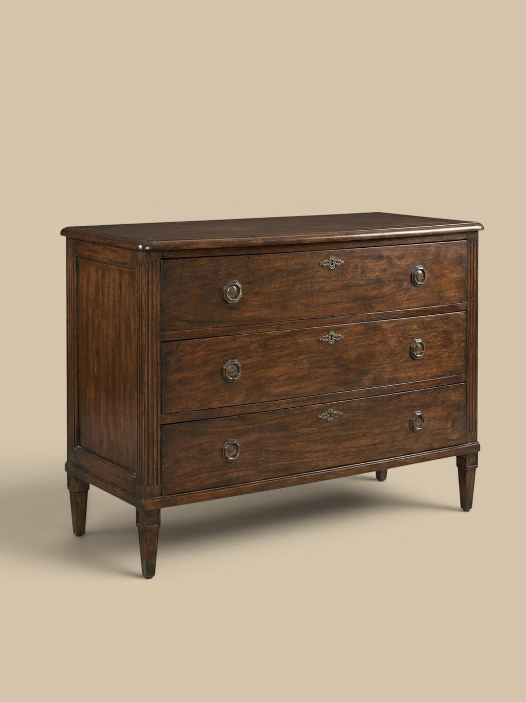 Homestyle Collective Andrews Chest, a dark brown hardwood dresser with three drawers and tarnished brass hardware, featuring fluted side panels and tapered legs.