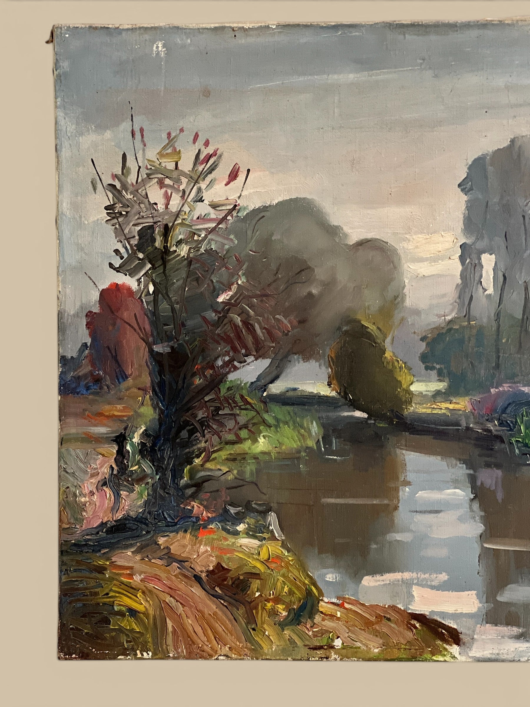 Homestyle Collective antique oil painting of a serene river landscape with trees and cloudy sky.