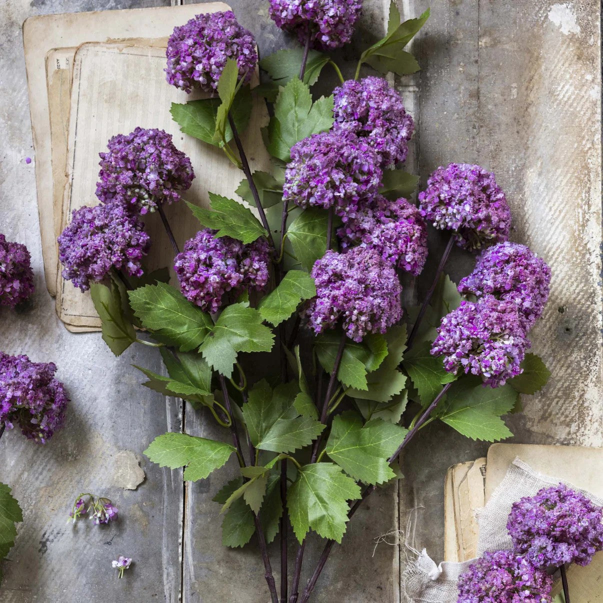 Homestyle Collective Artificial Guelder Rose Mauve, a single stem with abundant purple flower heads and green leaves.