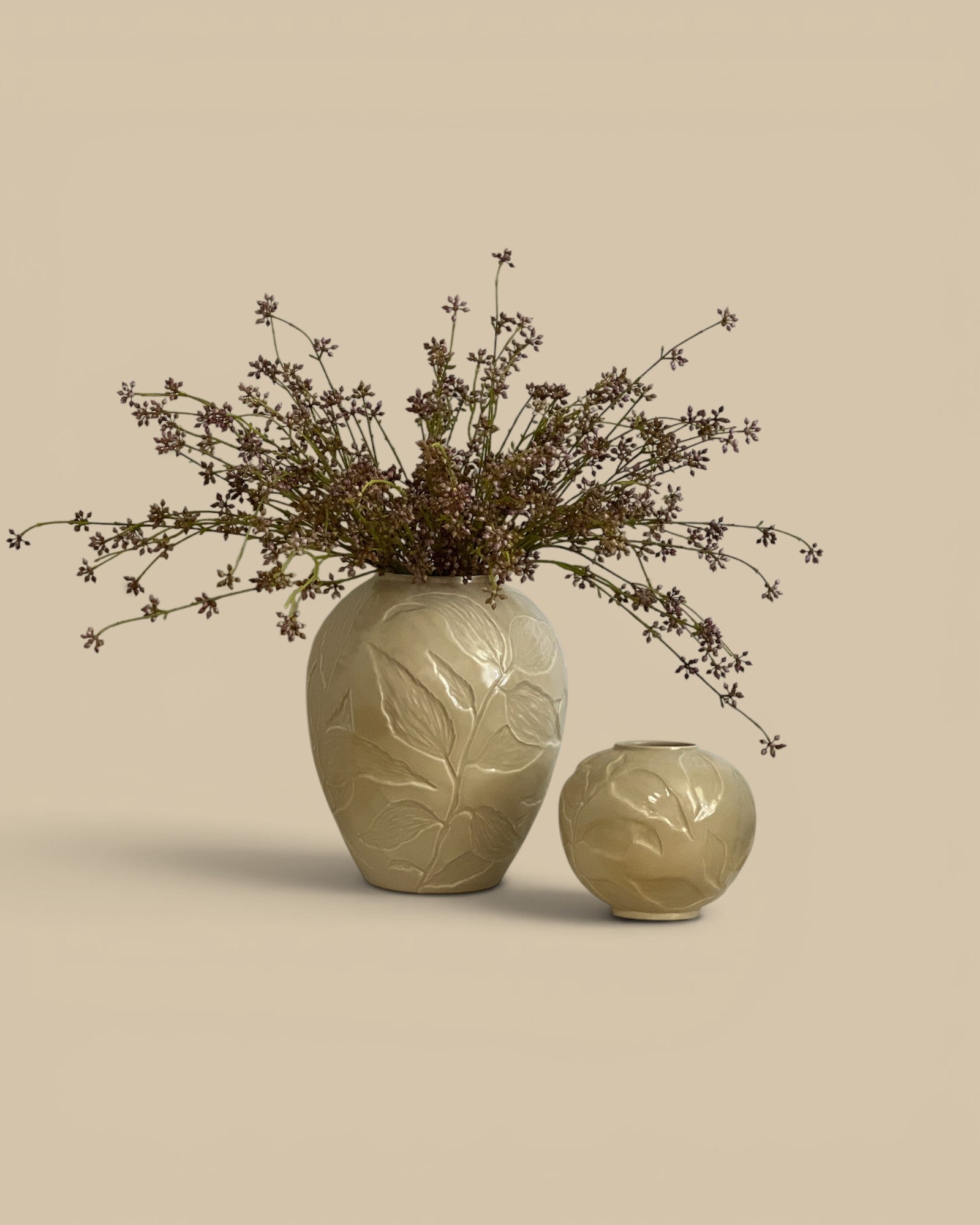 Homestyle Collective blush artificial succulent bunch with 3 stems in a decorative vase.