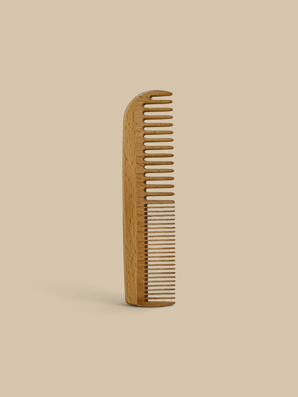 Homestyle Collective 7-inch beechwood hair comb with wide and fine teeth for detangling and smoothing.