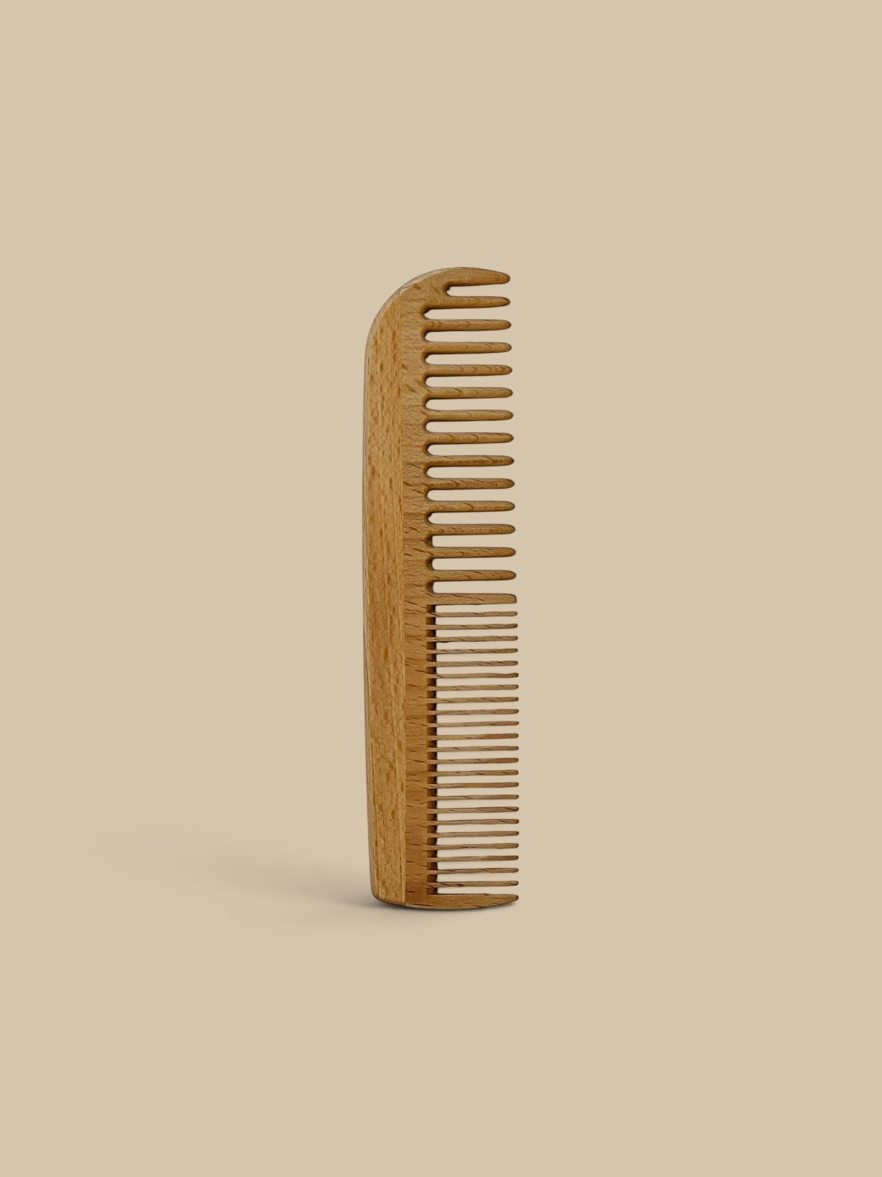Homestyle Collective 7-inch beechwood hair comb with wide and fine teeth for detangling and smoothing.