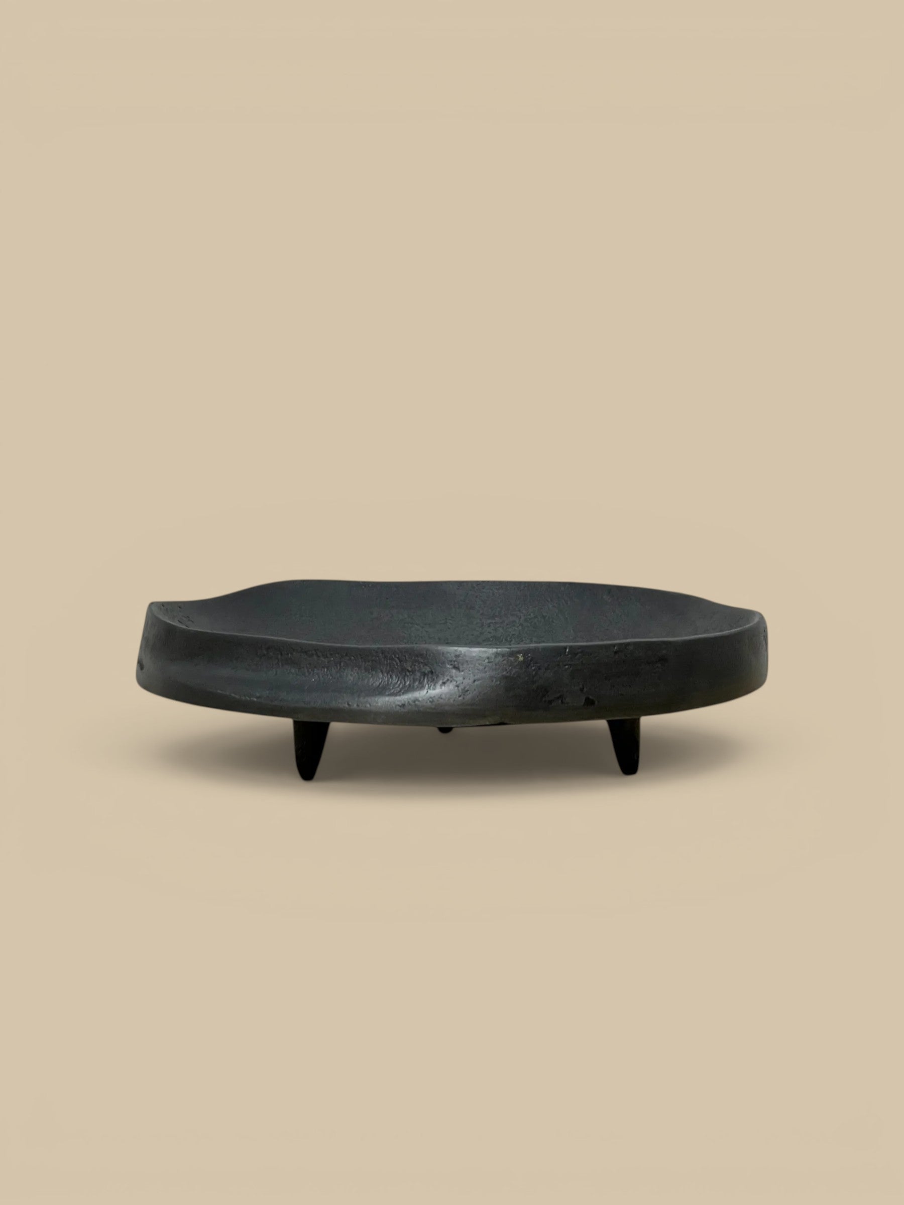 Homestyle Collective black matte aluminum footed dish with organic shape and indented center. 8" Round x 2" H.