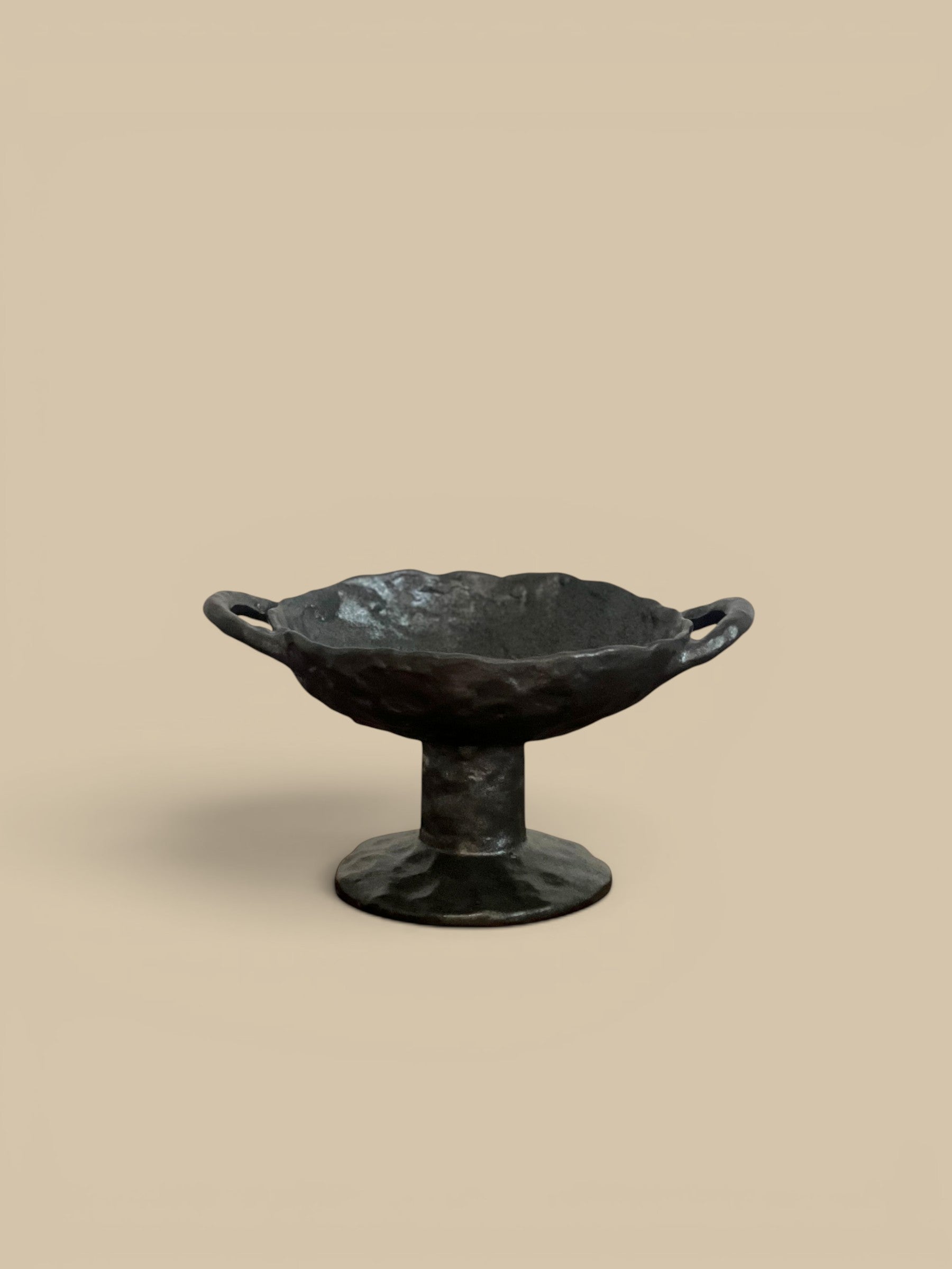 Homestyle Collective black stoneware pedestal bowl with handles and reactive glaze finish, 9.5" L x 6.5" W x 5" H.