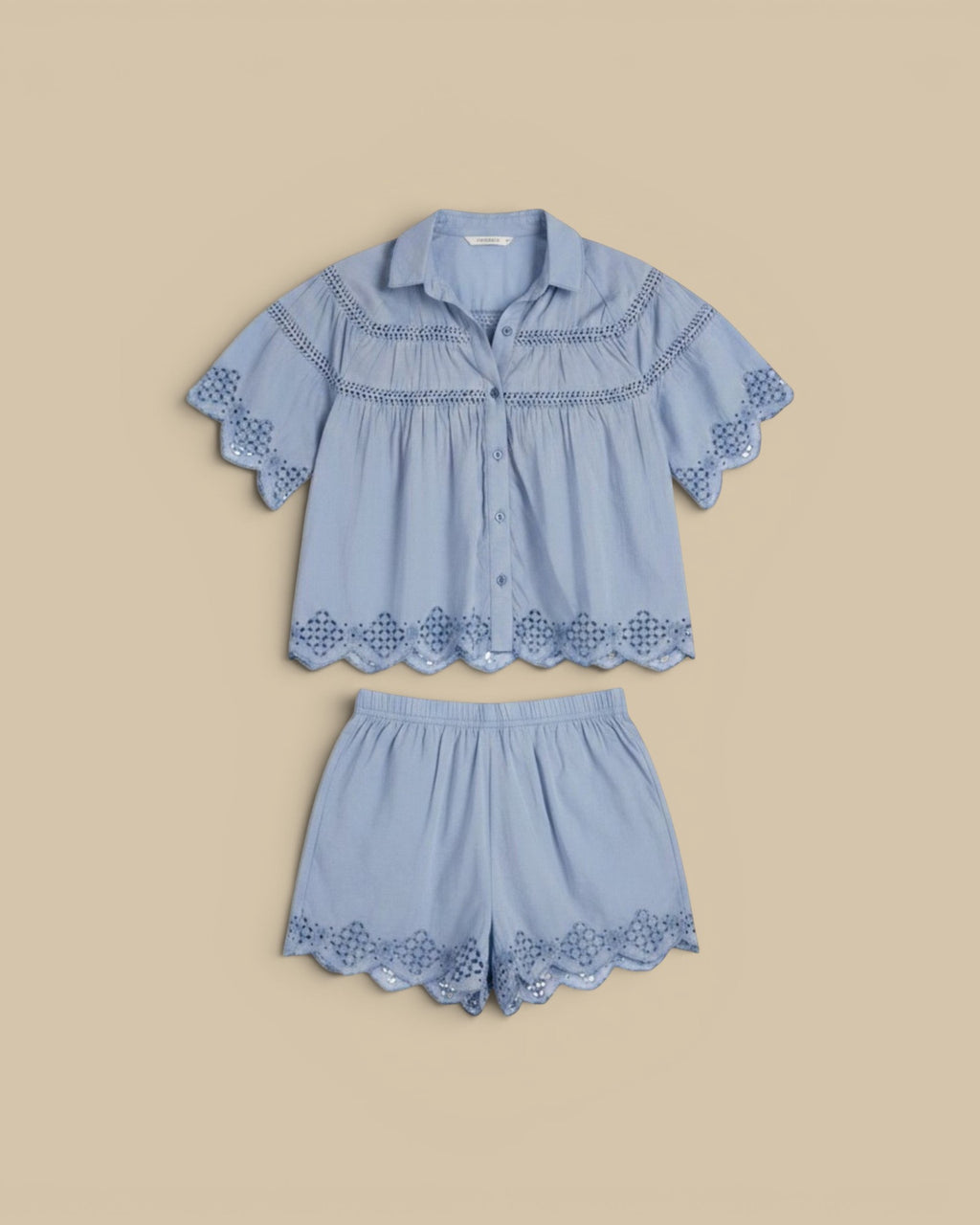 Homestyle Collective light blue cotton silk short sleeve button-up shirt with lace detailing and matching shorts.