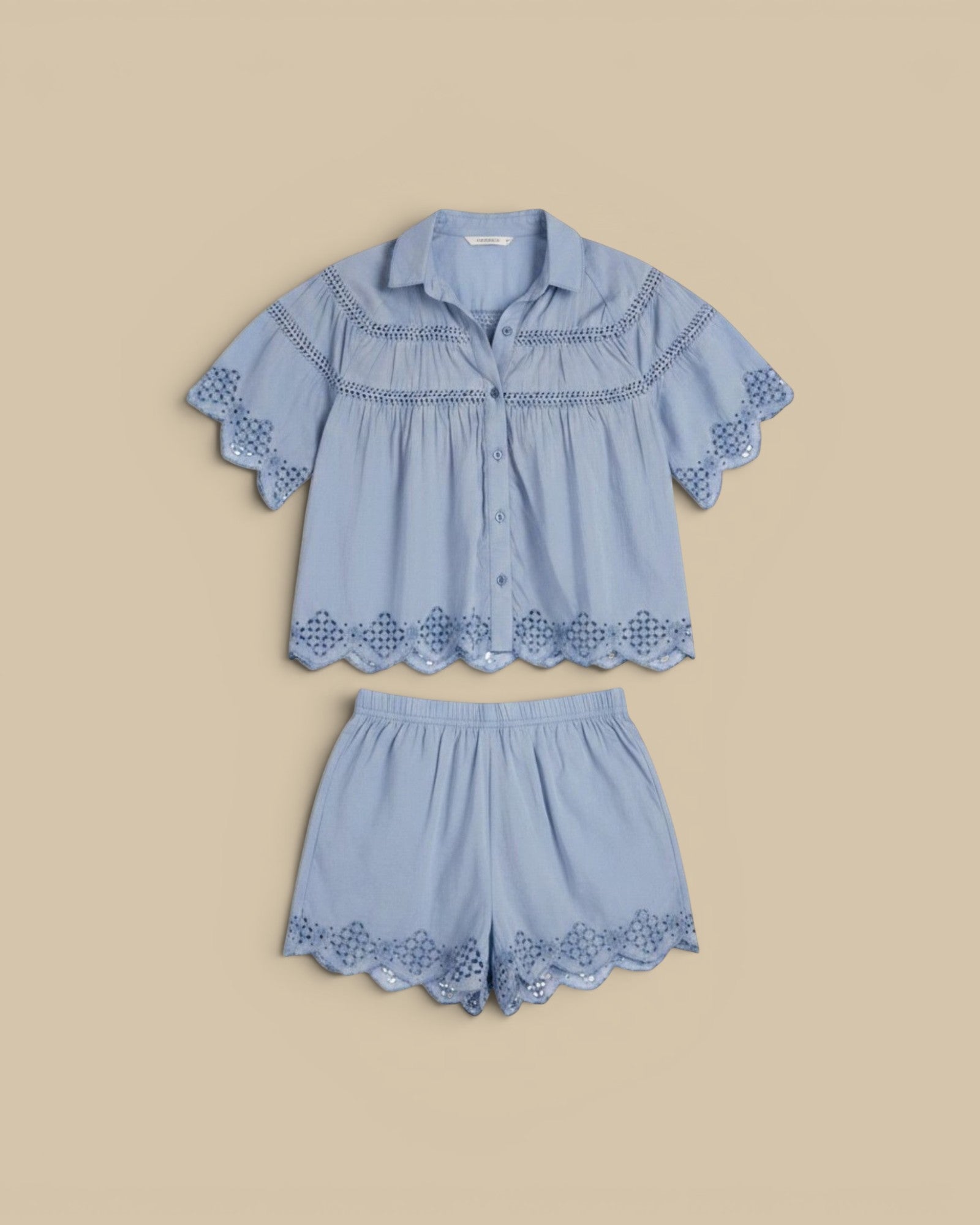 Homestyle Collective light blue cotton silk short sleeve button-up shirt with lace detailing and matching shorts.