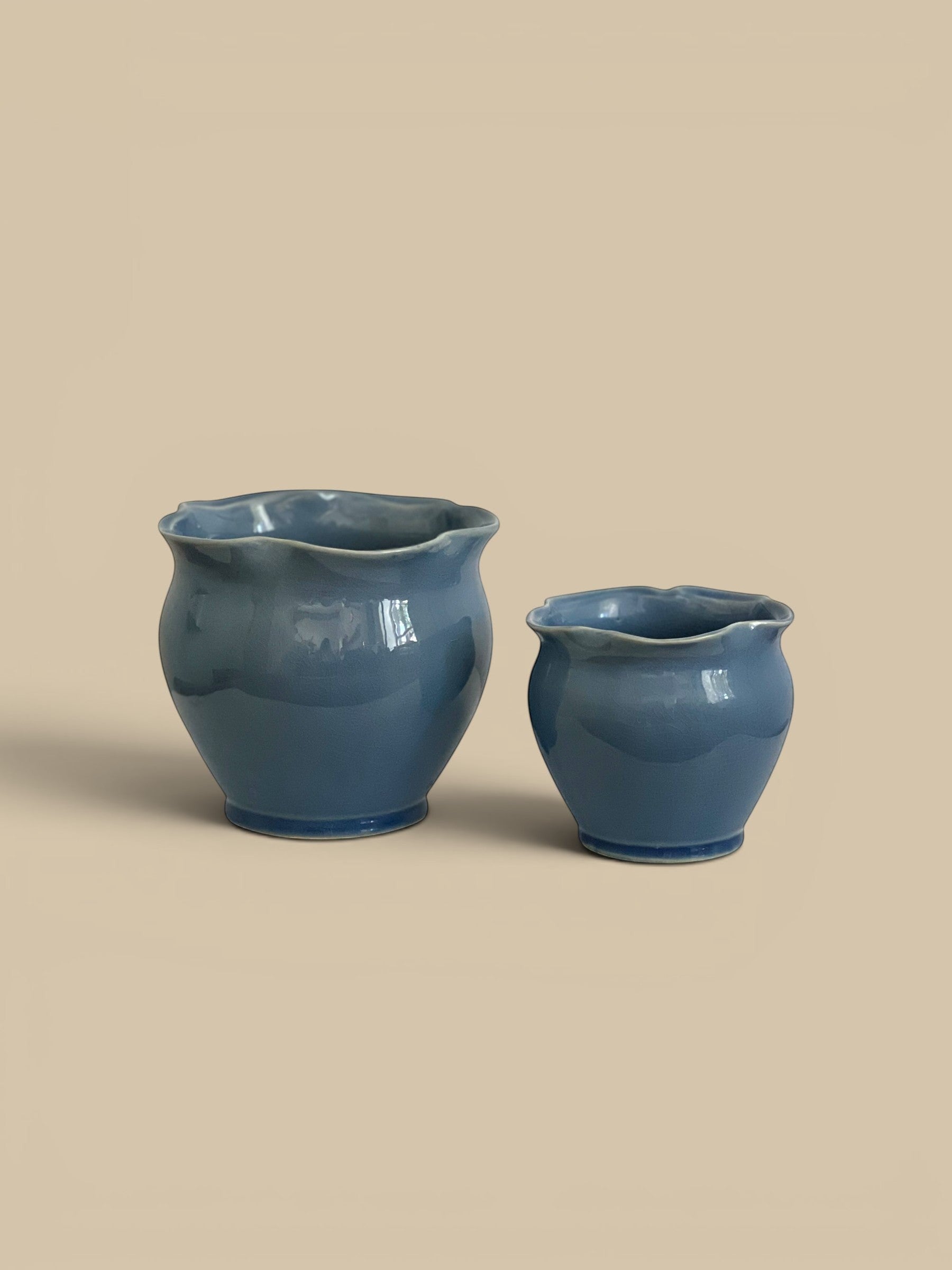 Homestyle Collective Megan Planter Pot set of 2, deep blue glazed ceramic with ruffled rim, perfect for flowers or herbs.