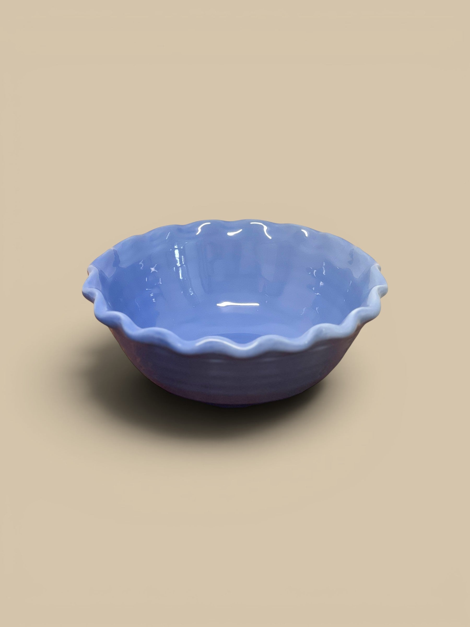 Homestyle Collective light blue scalloped stoneware serving bowl with ruffled edges and glazed finish.