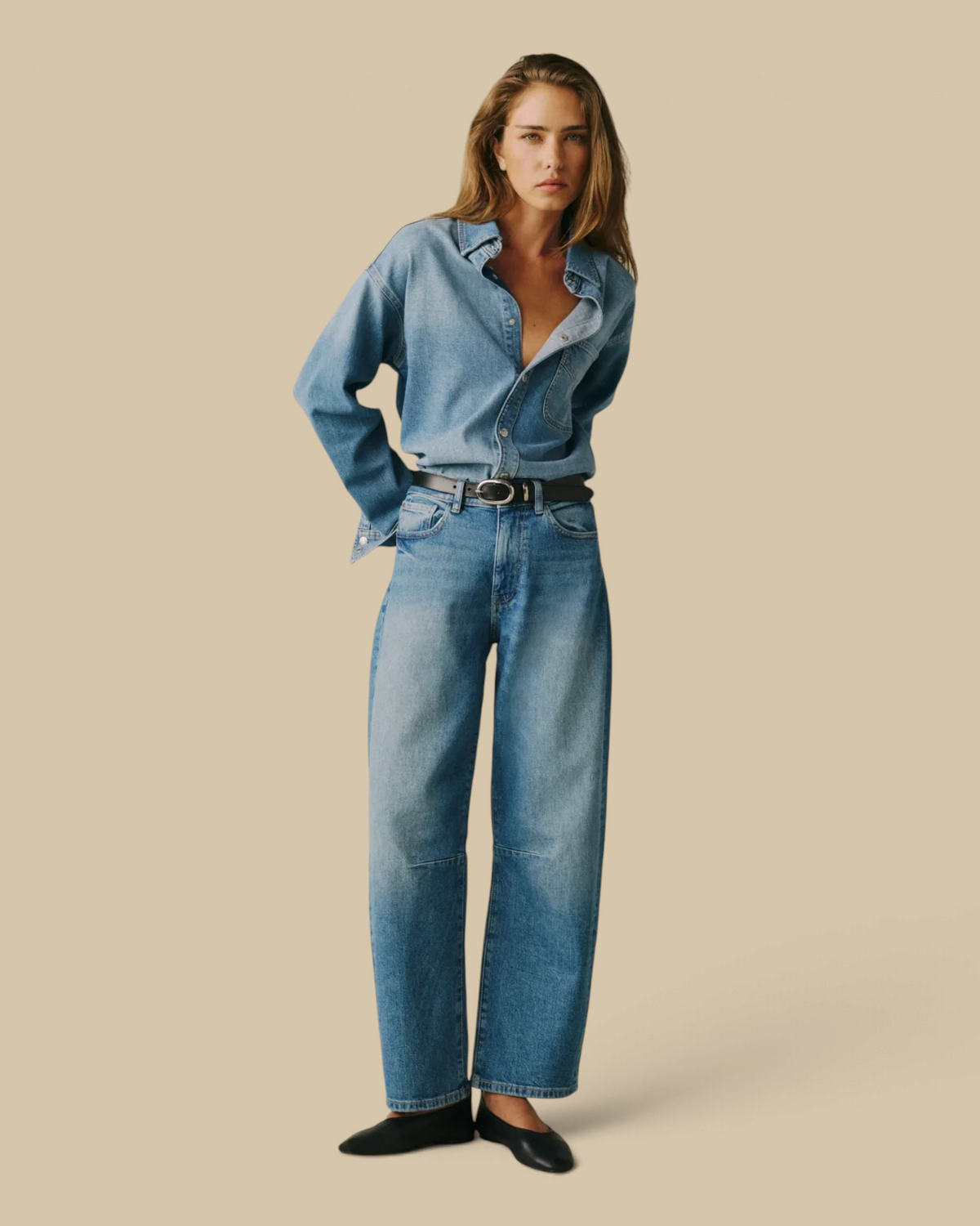 Homestyle Collective BNA soft curve barrel jeans in Sadie medium wash denim worn by a model with a denim shirt.