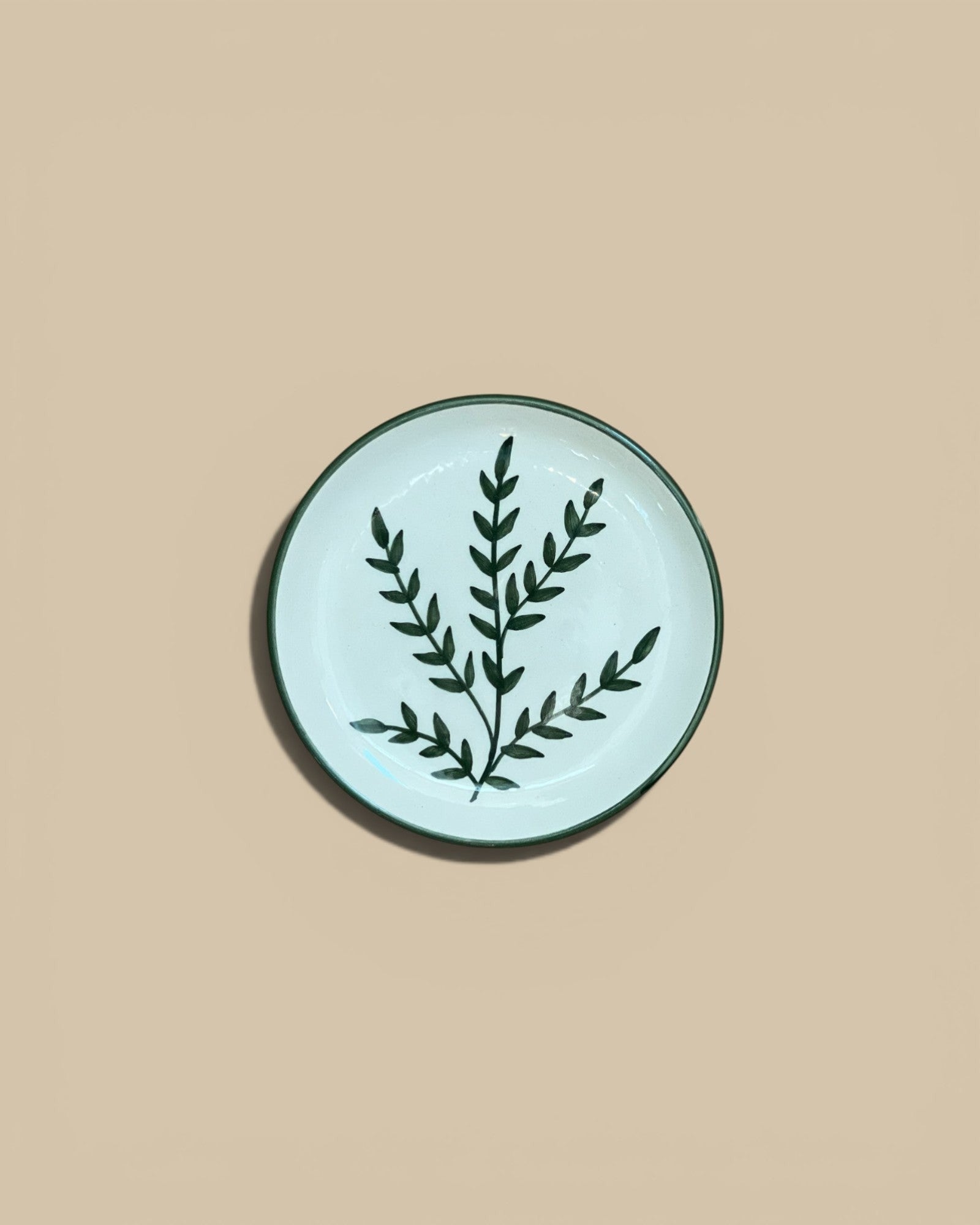 Homestyle Collective 5" round stoneware plate with hand-painted dark green botanical design on cream background.