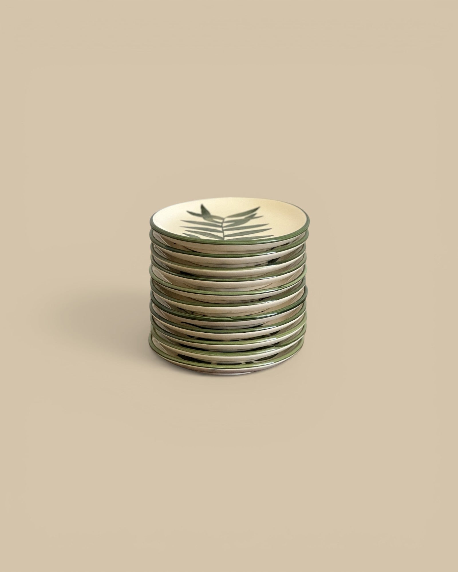 Homestyle Collective 5" round stoneware plate with hand-painted botanical design in cream and dark green.