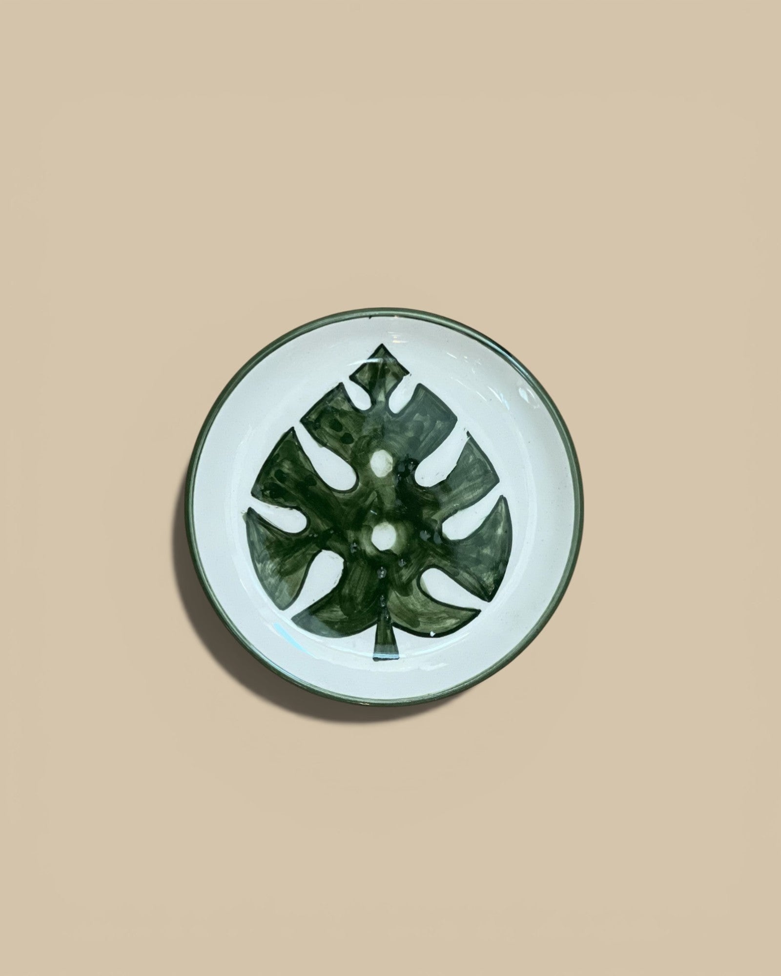 Homestyle Collective 5" round stoneware plate hand-painted with a dark green botanical leaf design on a cream background.