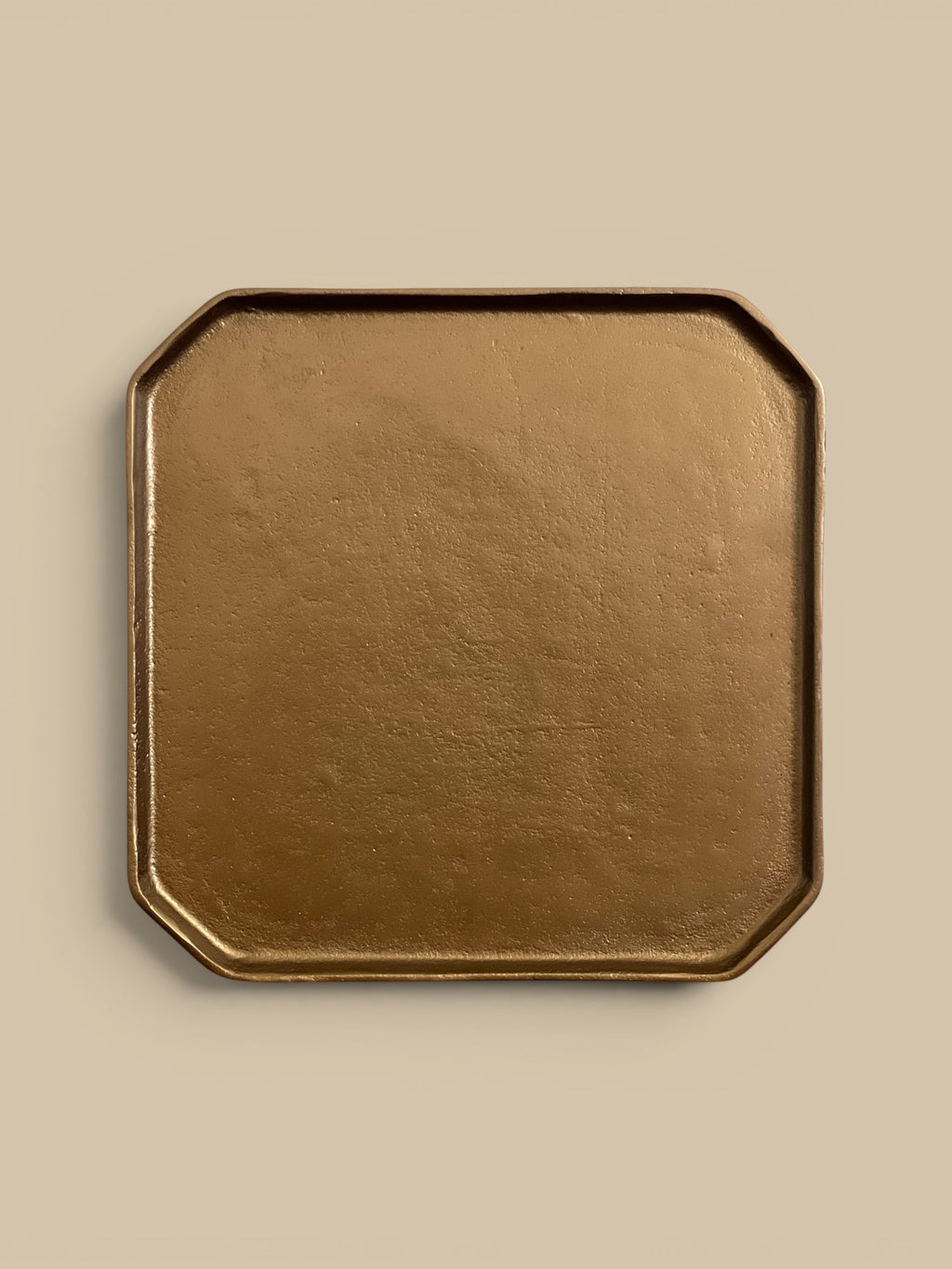 Homestyle Collective brass aluminum tray with octagonal shape and raised edge, perfect for keys, jewelry, or as a decorative accent.
