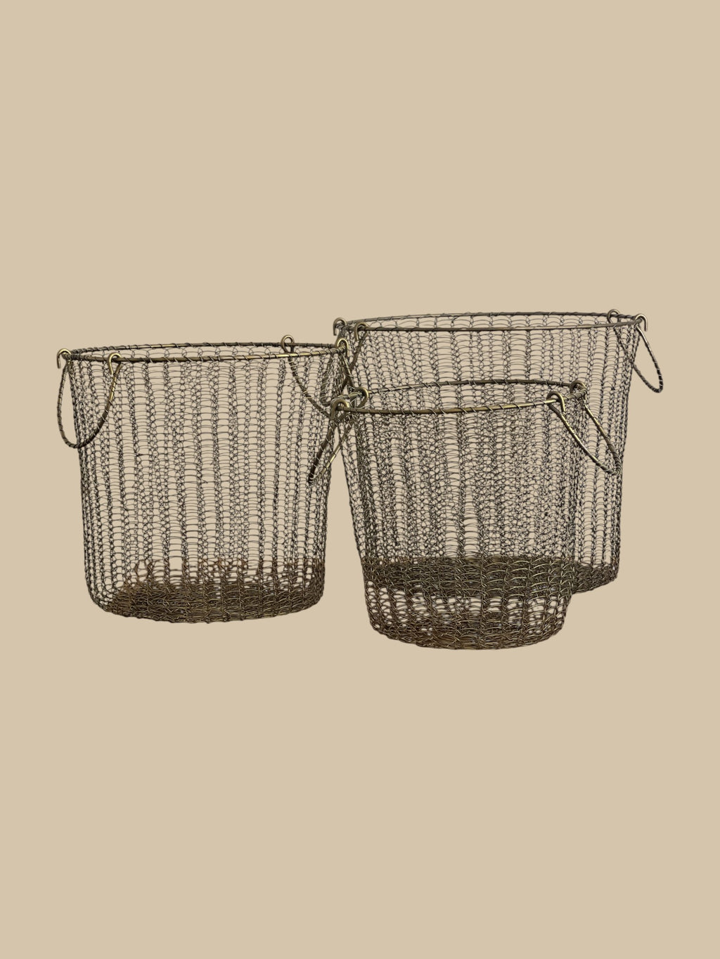 Homestyle Collective Moana brass wire baskets, set of 3, with handles. Open weave design.