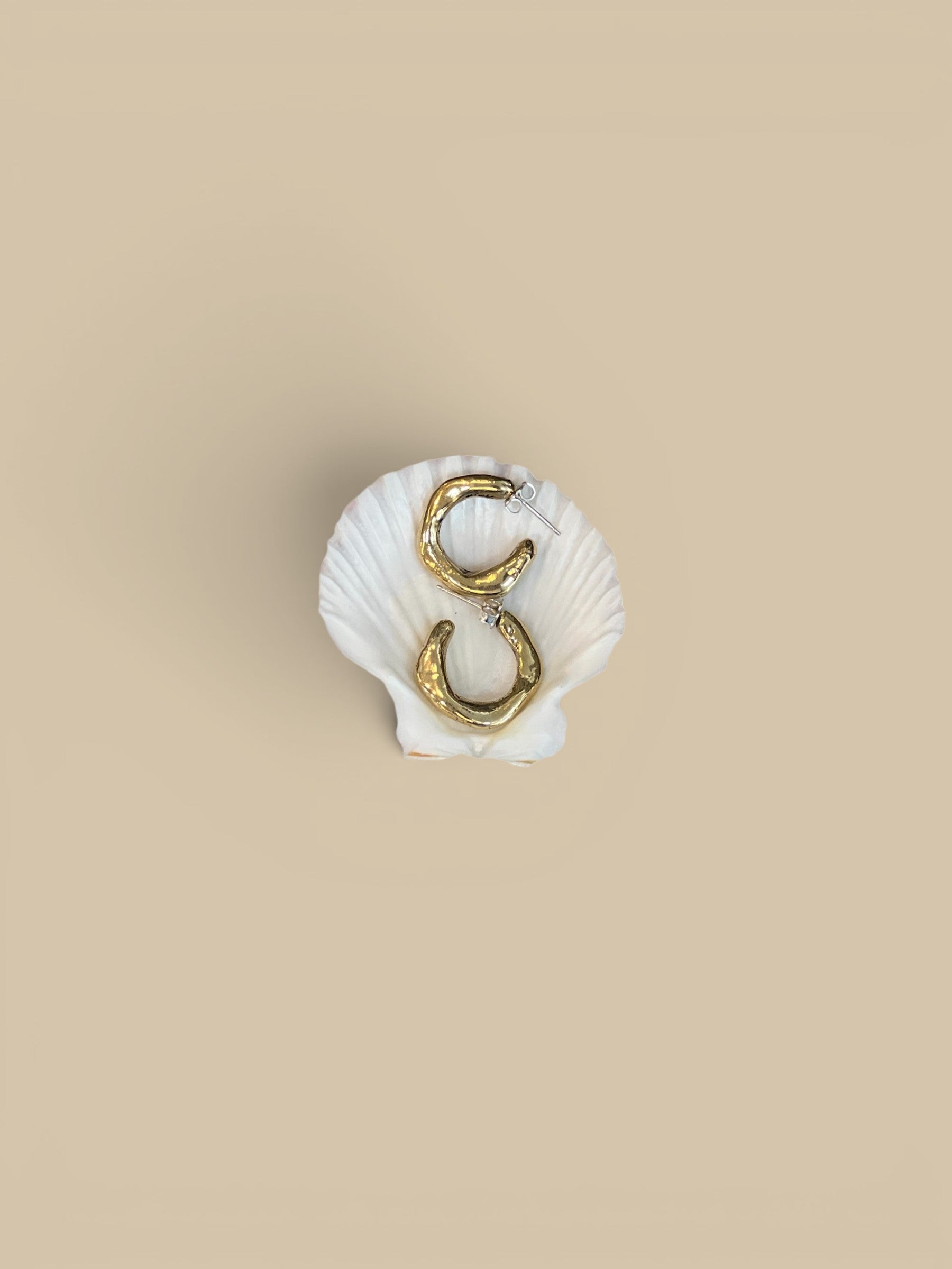 Homestyle Collective bronze maji hoop earrings with organic shape and high shine finish. Sterling silver post.