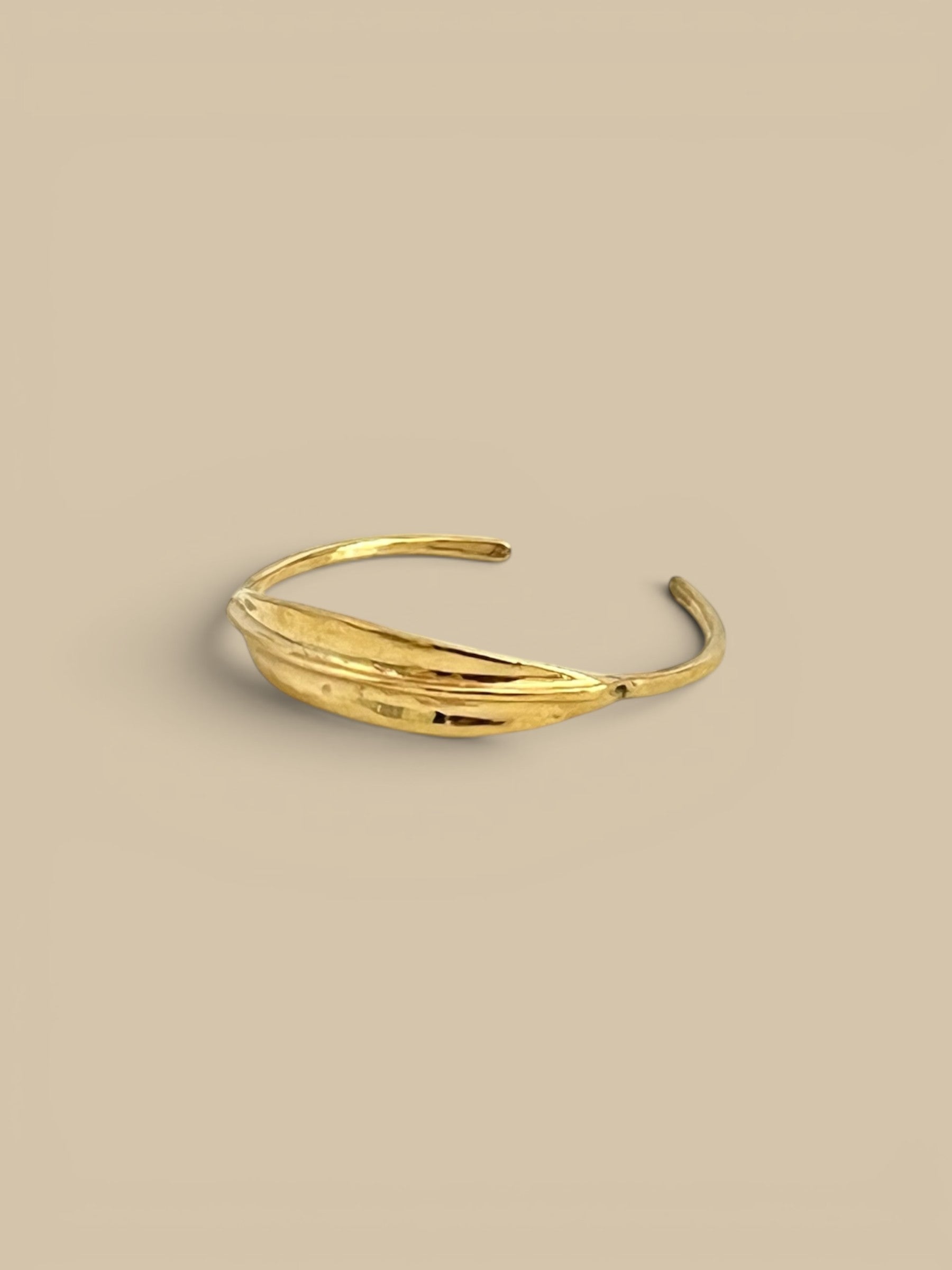 Homestyle Collective bronze ridge ID cuff bracelet with sculptural ridge detail, cast from wax.