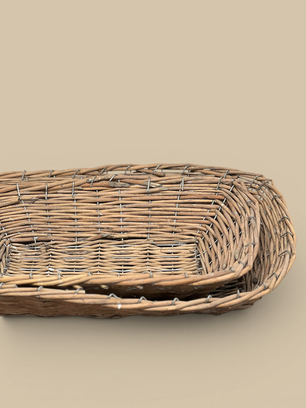 Homestyle Collective brown woven willow basket trays, perfect for home decor and organization. Set of two.
