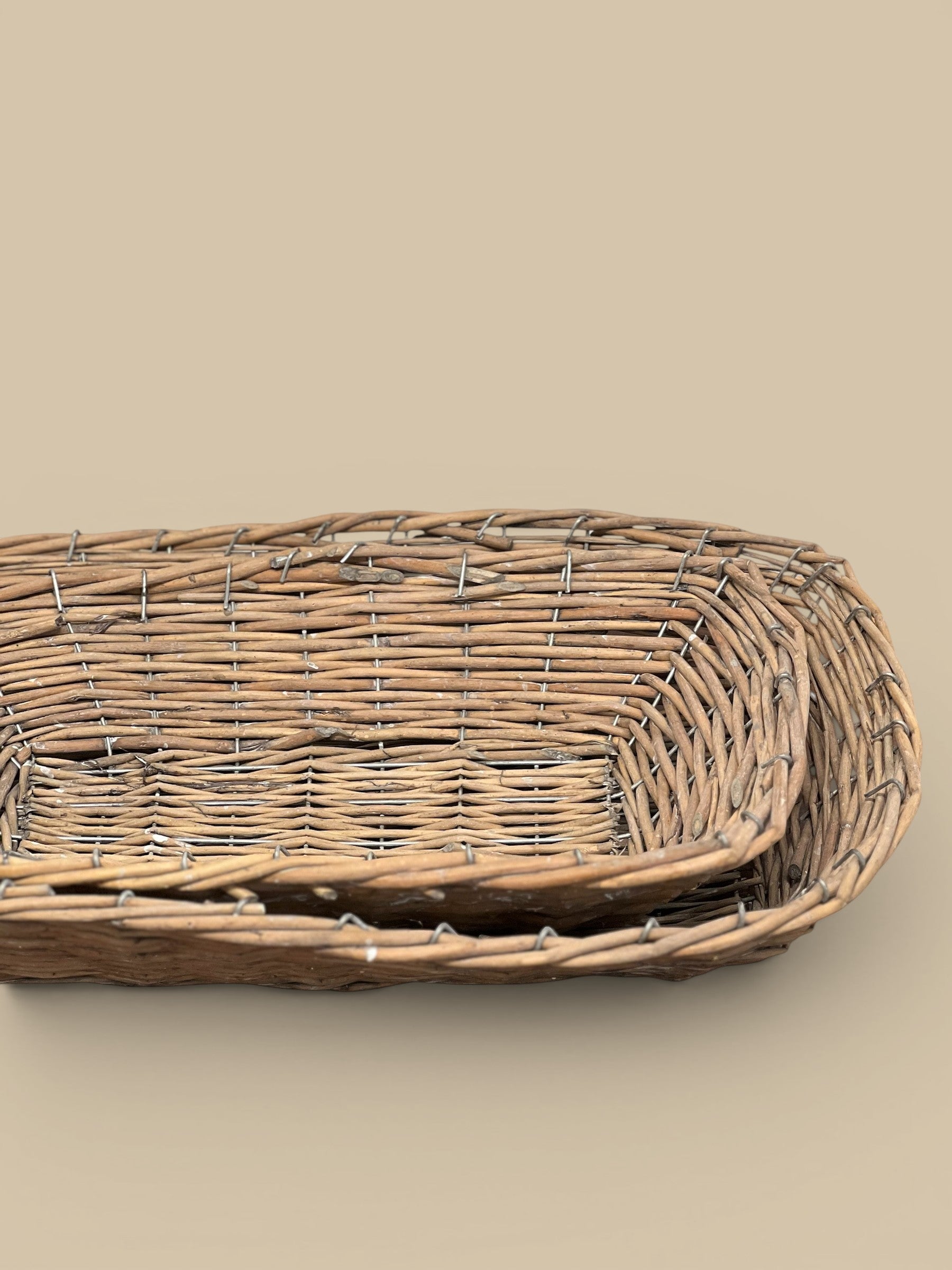 Homestyle Collective brown woven willow basket trays, perfect for home decor and organization. Set of two.