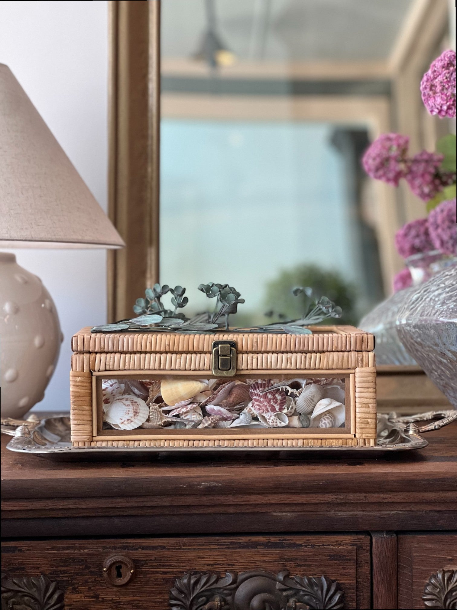 Homestyle Collective Cayman Rattan Display Case with glass front, metal latch, and woven texture. Perfect for shells.