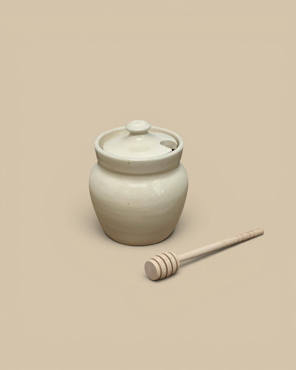 Homestyle Collective cream ceramic honey pot with lid and wooden dipper