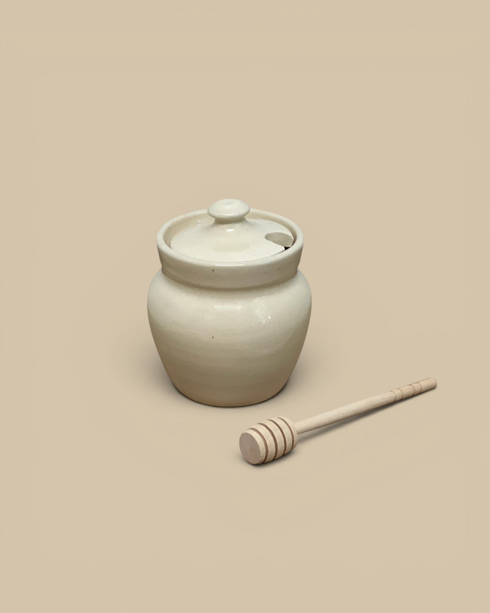 Homestyle Collective cream ceramic honey pot with lid and wooden dipper