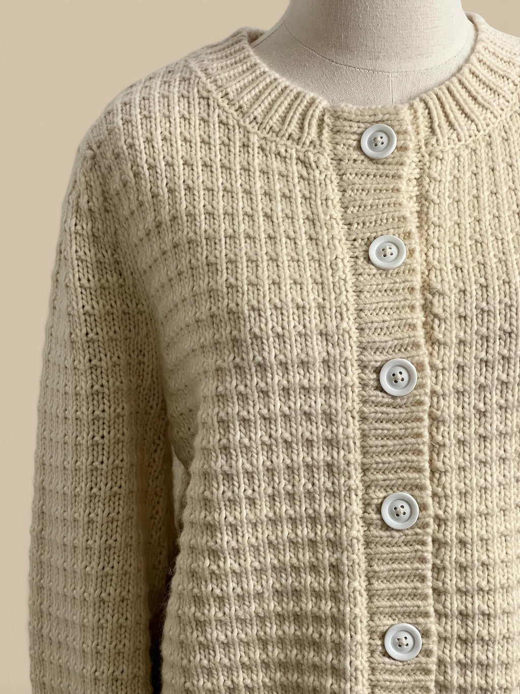 Homestyle Collective cream chunky knit cardigan with white buttons and ribbed detailing. 80% acrylic, 20% wool.