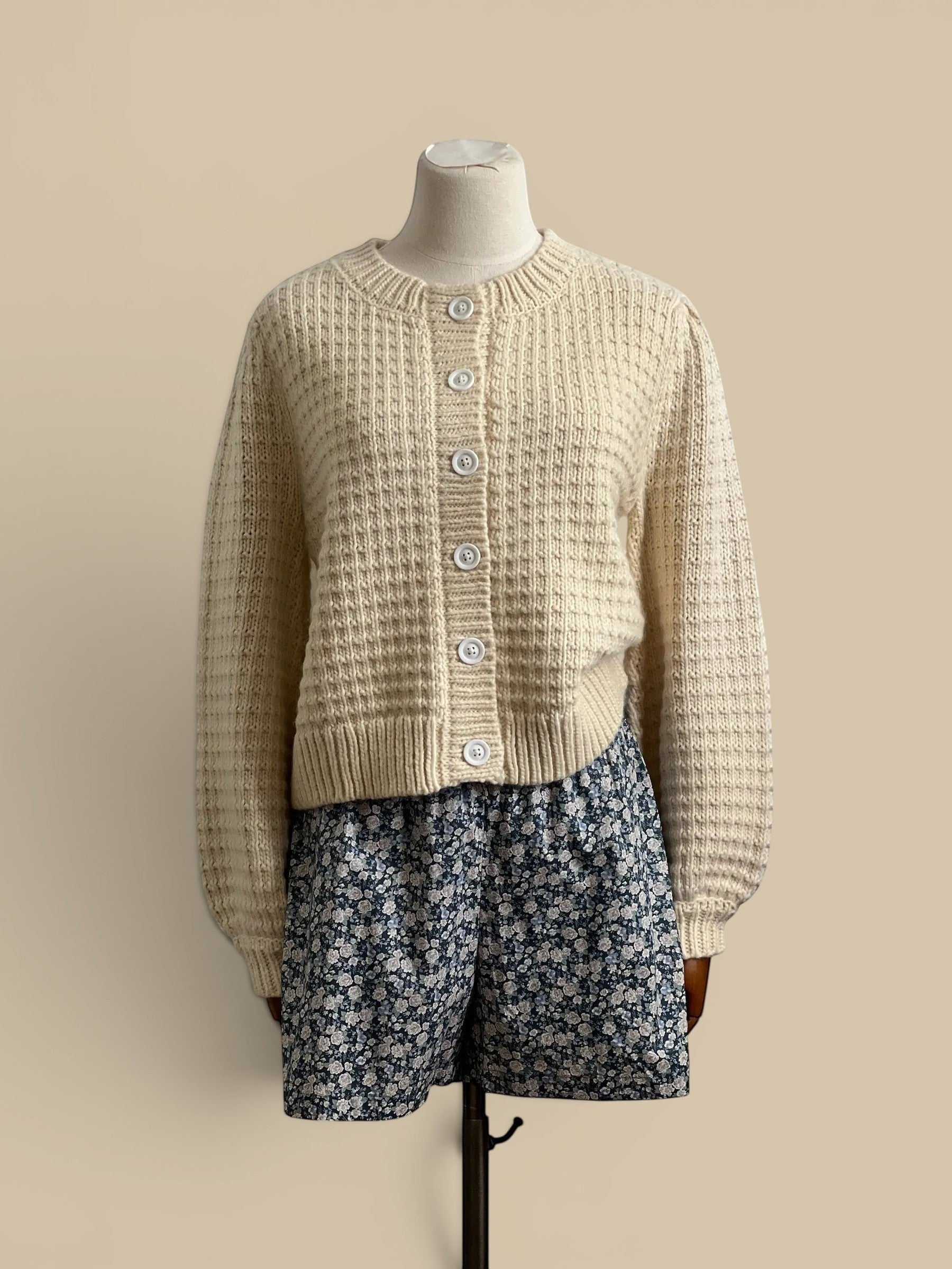Homestyle Collective cream chunky knit cardigan with white buttons and ribbed detailing, 80% acrylic, 20% wool.