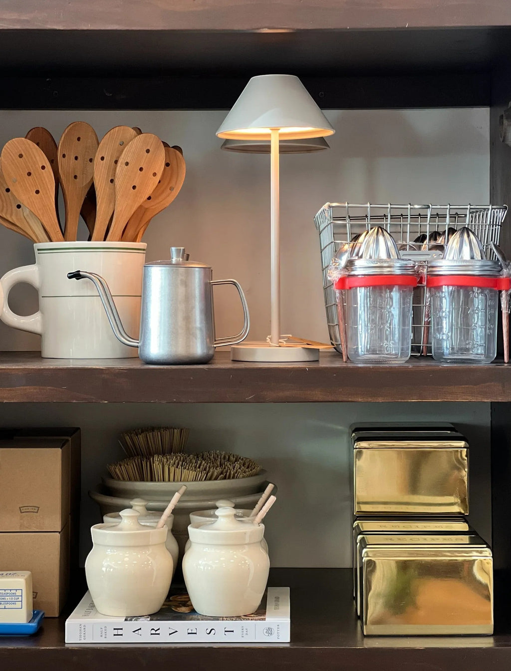 Homestyle Collective ClearCraft glass and stainless steel juicer jars with red lids and built-in juicers.