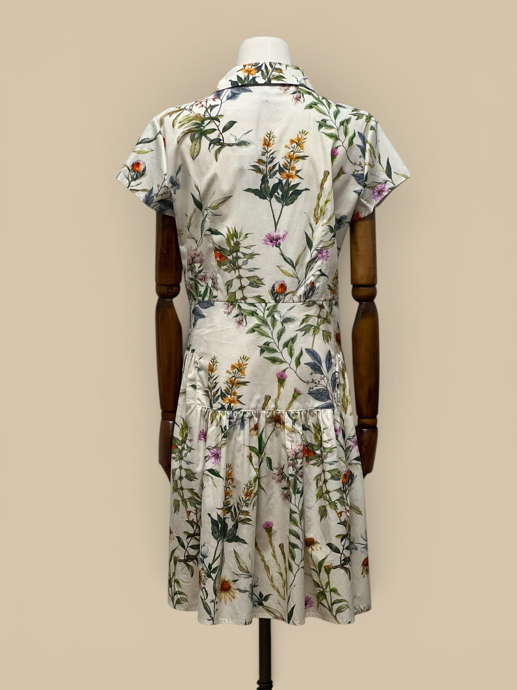 Homestyle Collective Collette Dress, a short-sleeve floral print midi dress with a collared neckline and tiered hem.