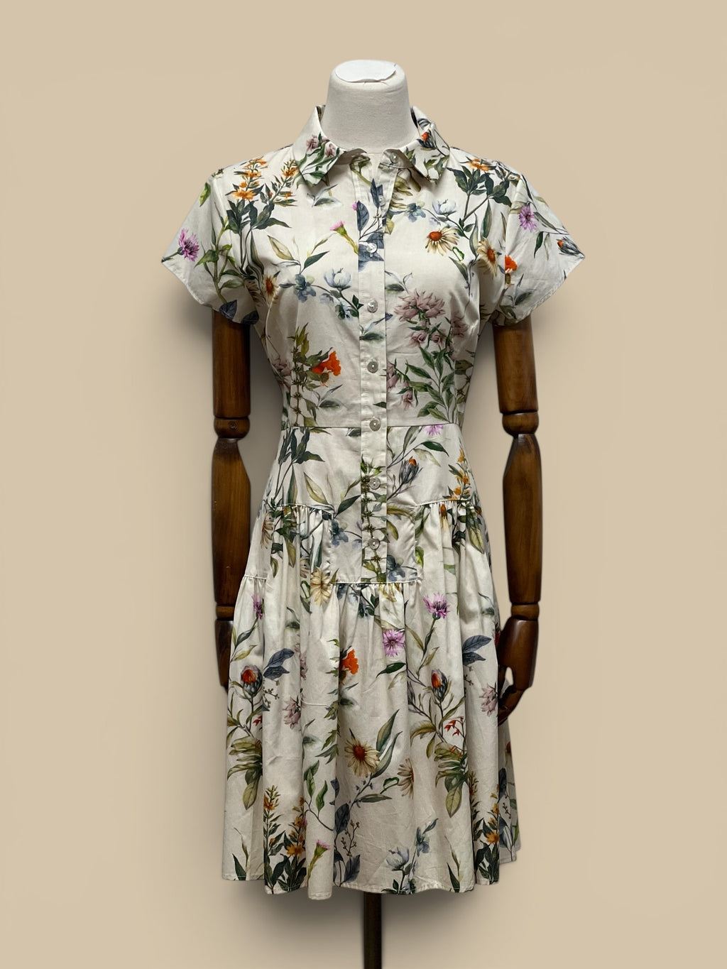 Homestyle Collective Collette Dress: cream floral print shirt dress with short sleeves and tiered skirt.