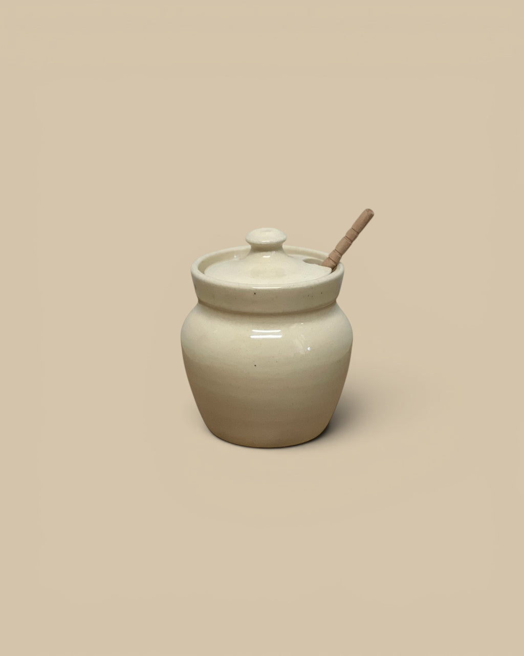 Homestyle Collective cream ceramic honey pot with lid and wooden dipper