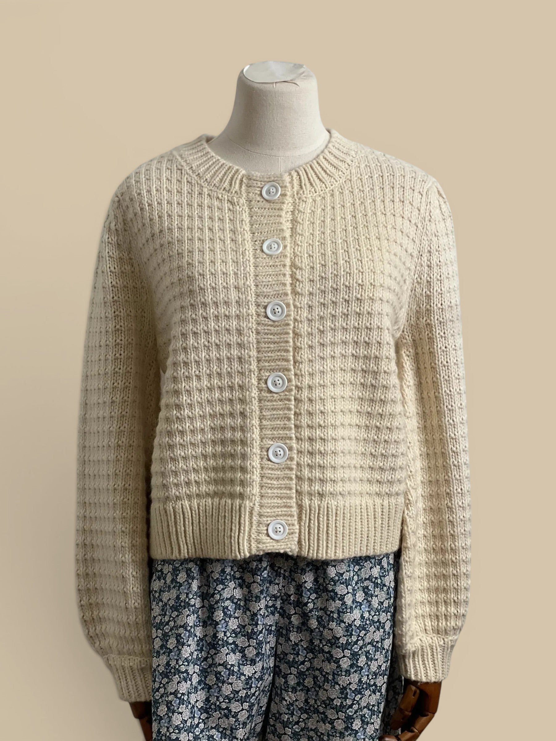 Homestyle Collective cream chunky knit cardigan with ribbed detailing and white buttons. 80% acrylic, 20% wool.