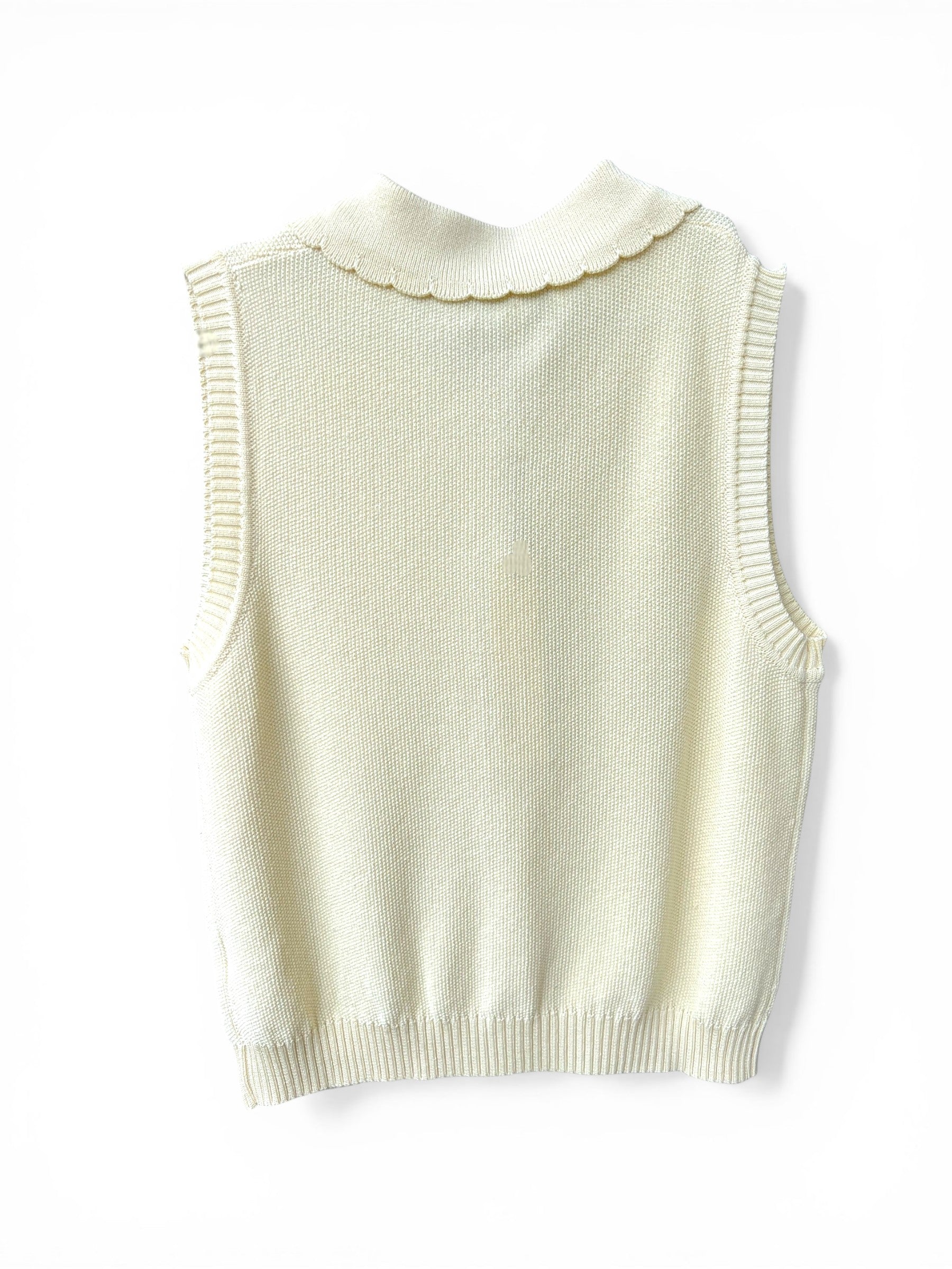 Homestyle Collective cream knit vest with scalloped collar and ribbed trim.