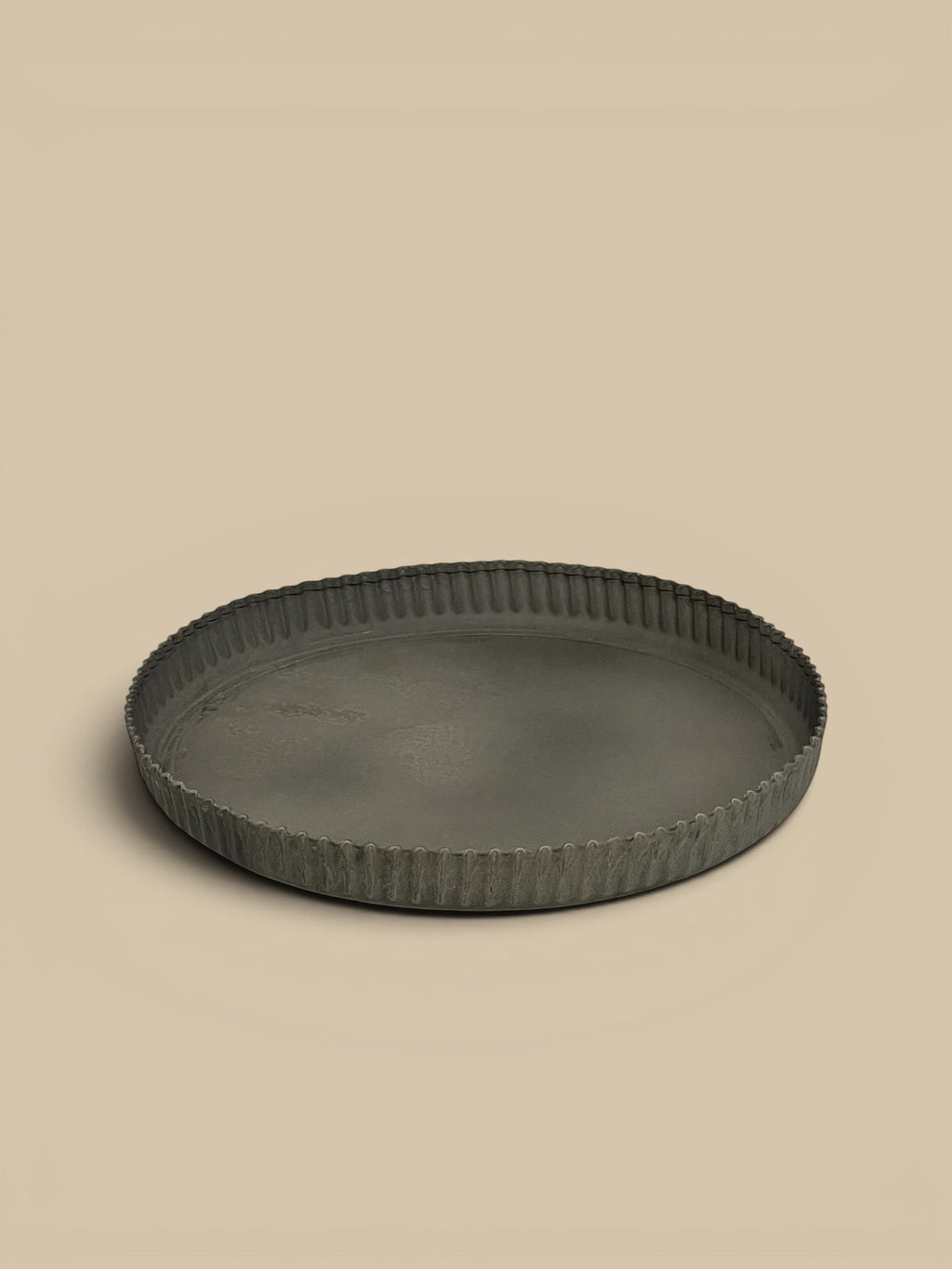 Homestyle Collective dark grey metal tart tray with crimped edges, vintage-inspired design.