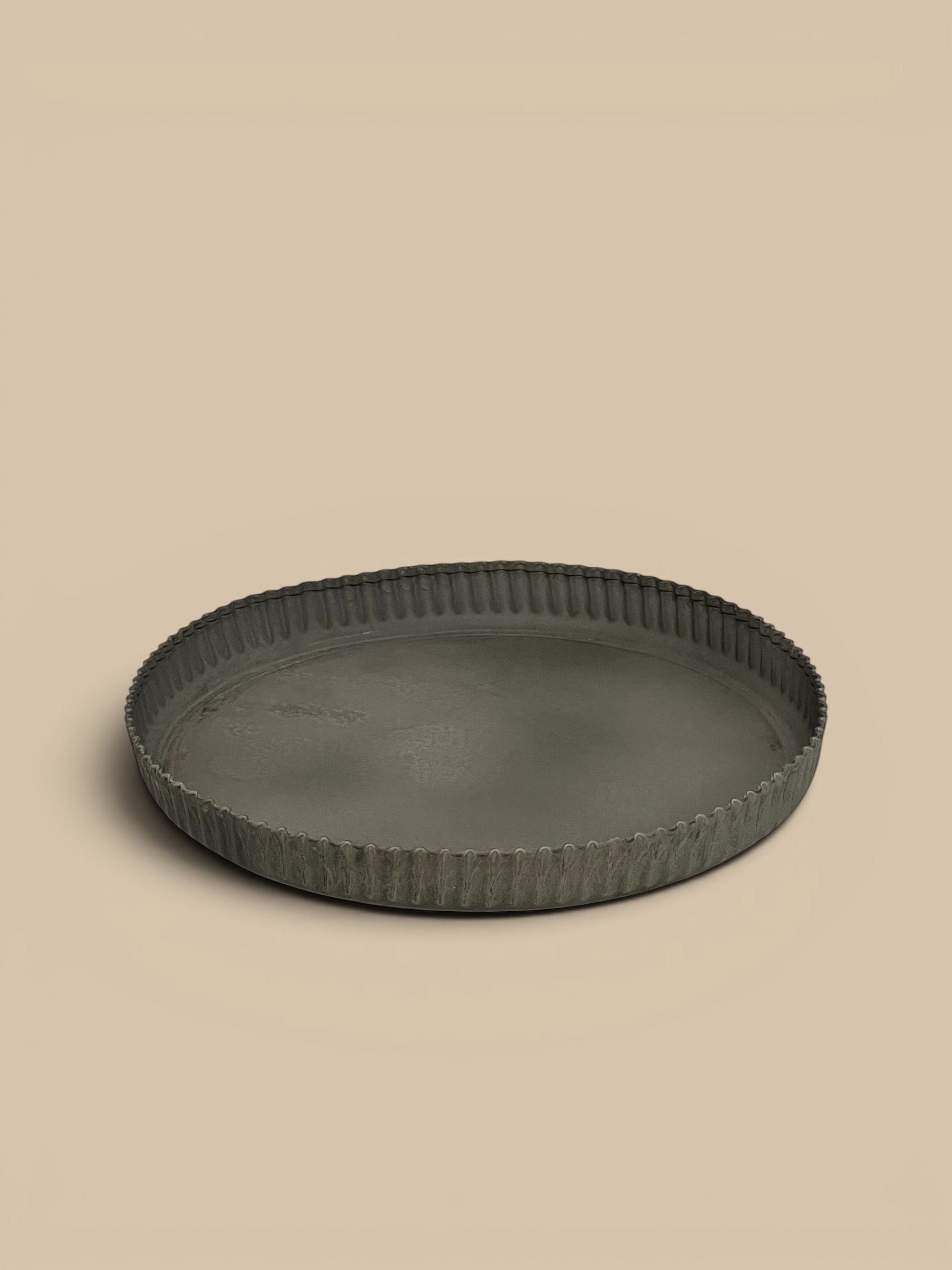 Homestyle Collective dark grey metal tart tray with crimped edges, vintage-inspired design.
